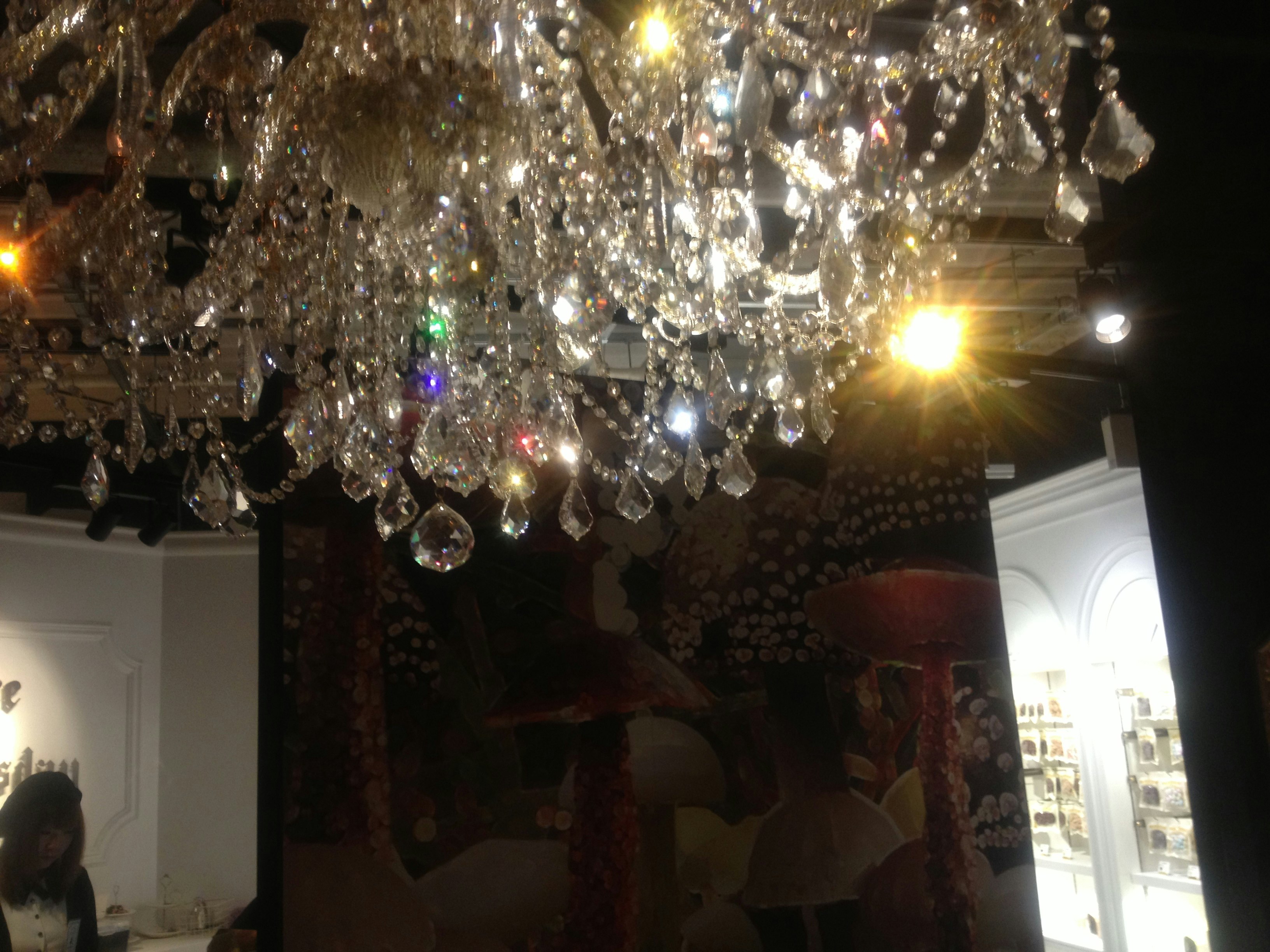 Indoor exhibition space with a sparkling chandelier