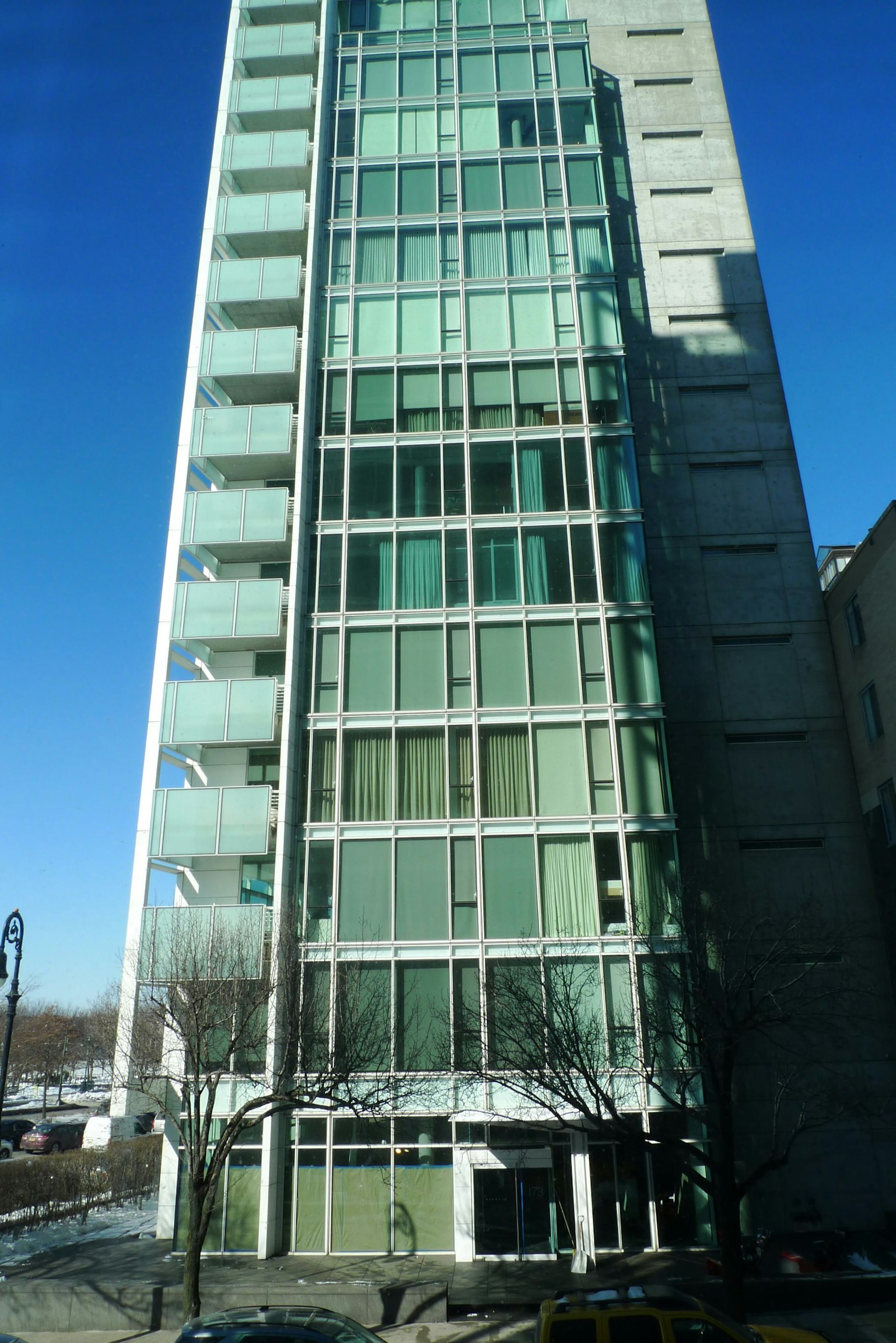 Modern glass facade building with blue sky