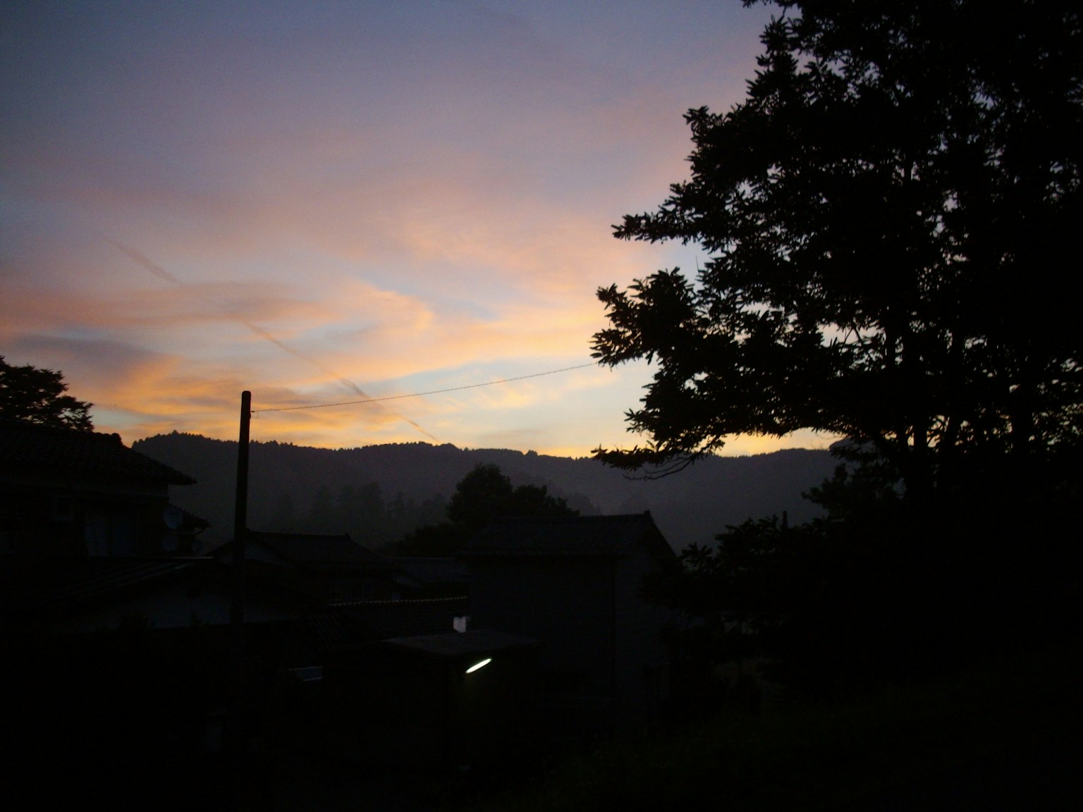 Scenic view of a beautiful sunset sky with silhouetted trees