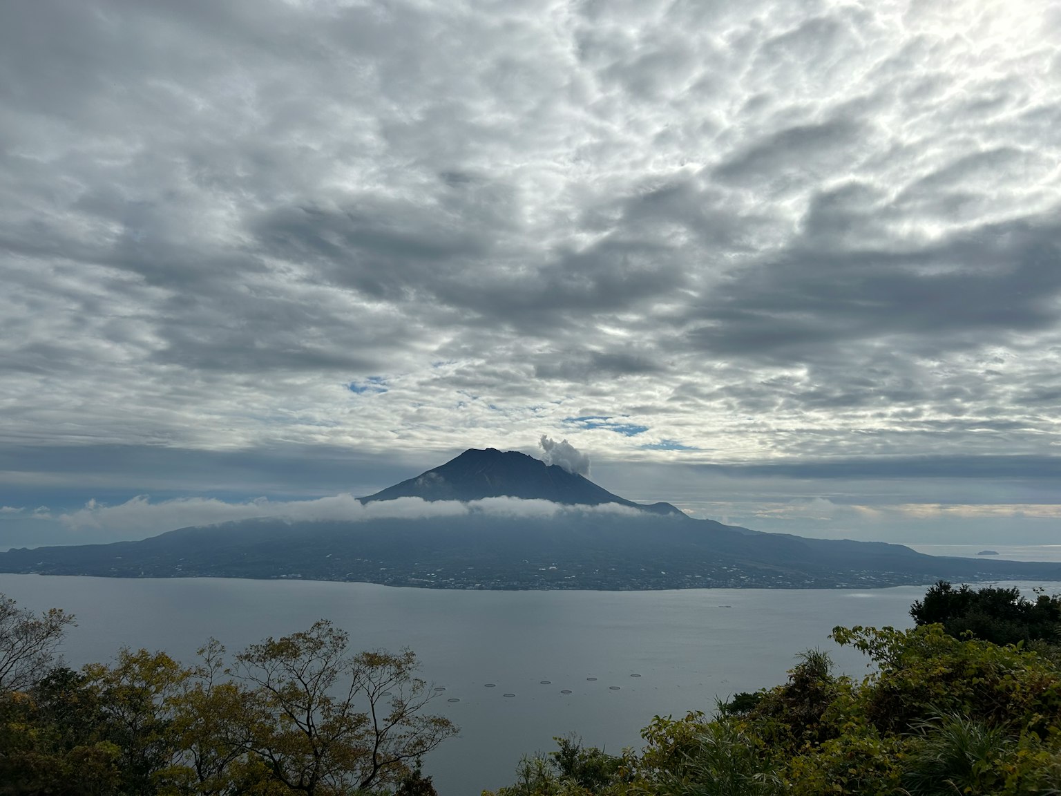 View of Lake Atitlán with clouds surrounding Volcano Atitlán