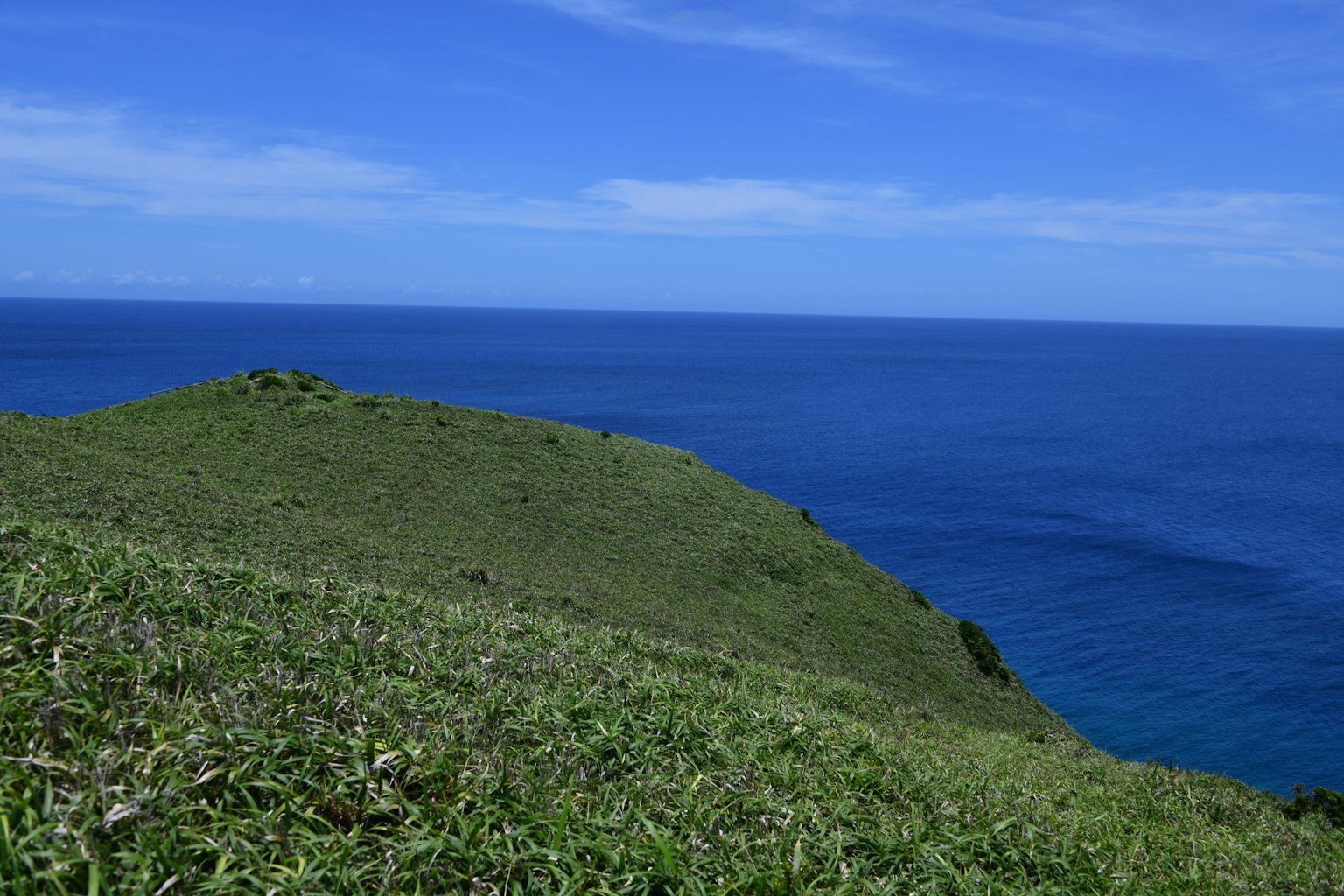 Beautiful landscape of blue ocean and green hill