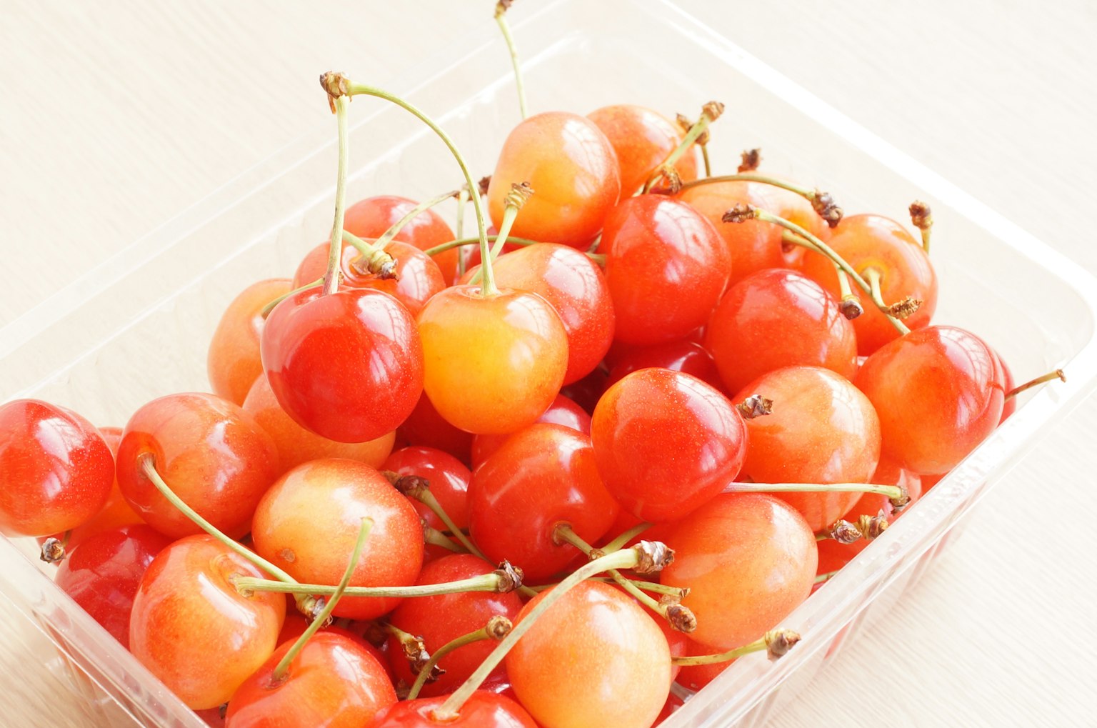 Red cherries in a transparent container