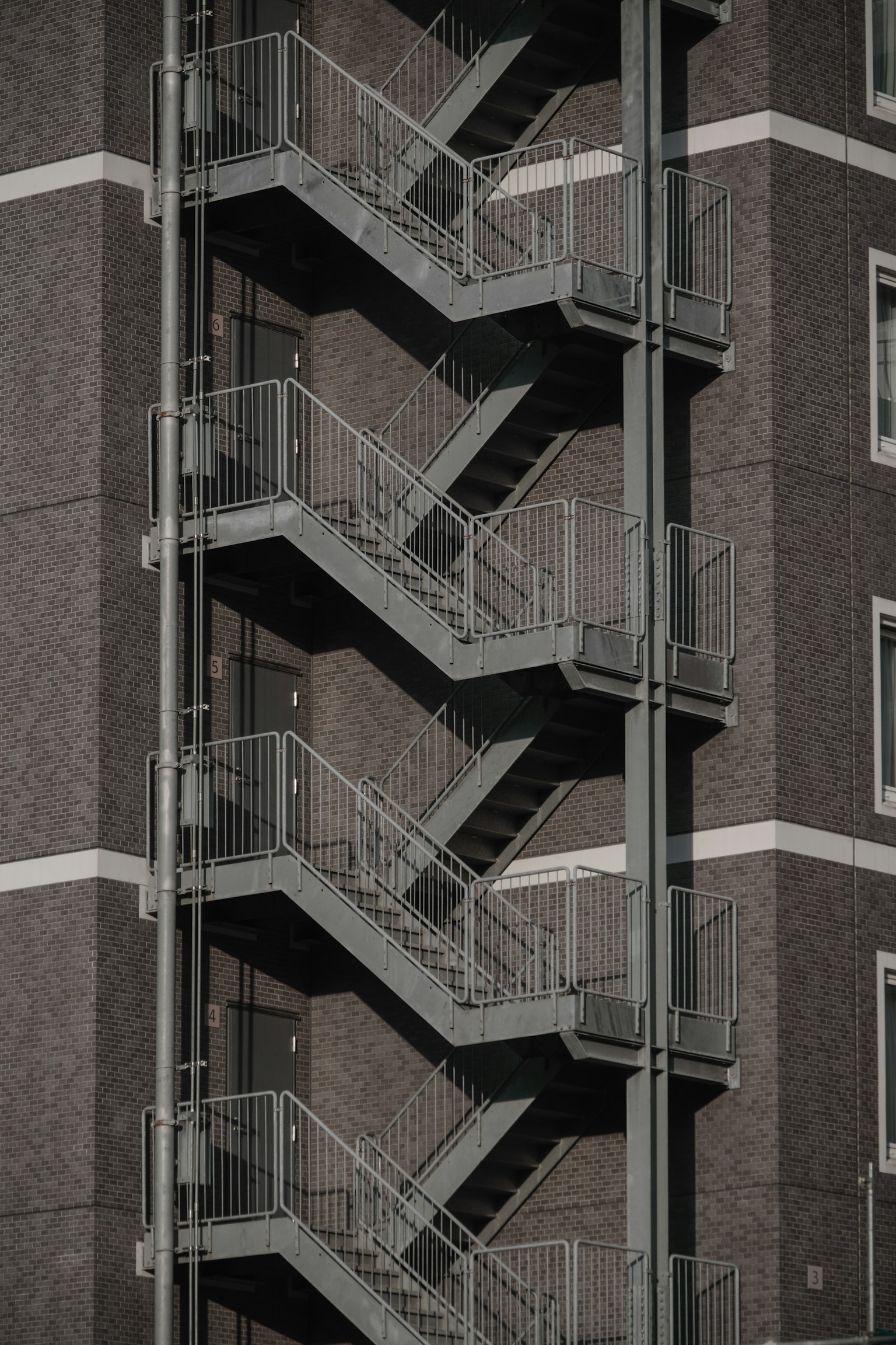 Detailed view of an external gray staircase on a building