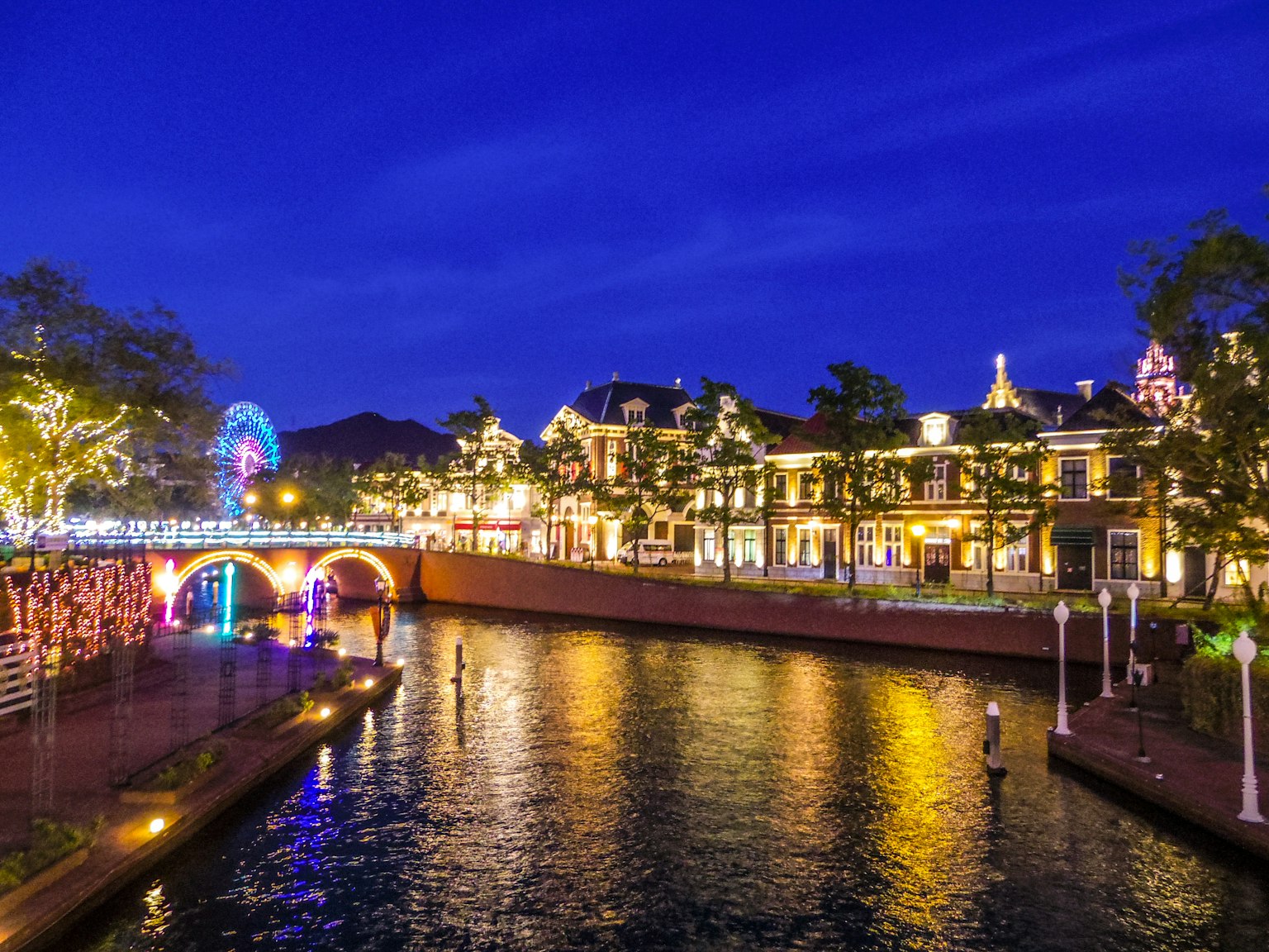 Beautiful riverside view at night with bright building lights