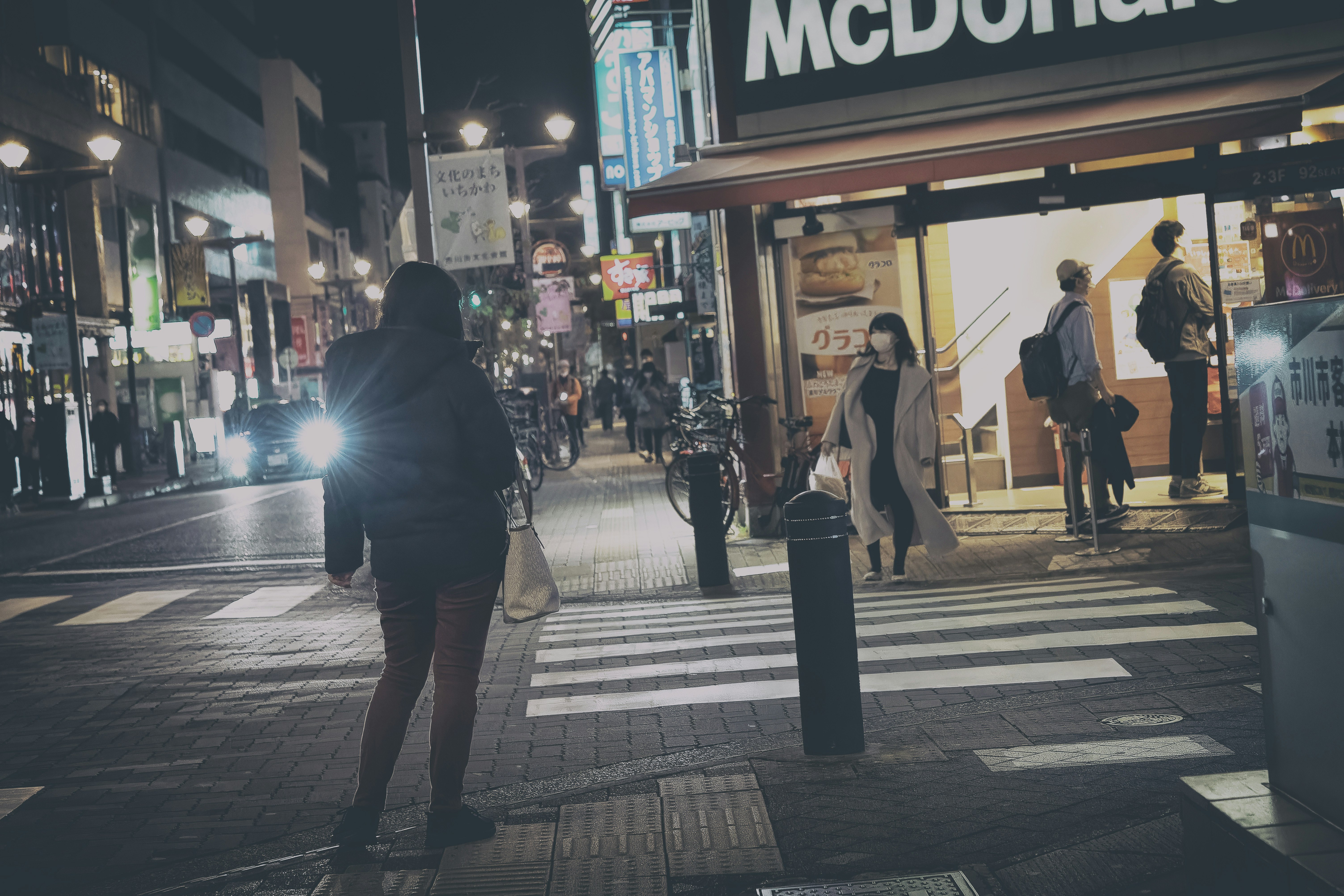 nighttime crosswalk and streetlights on a city street