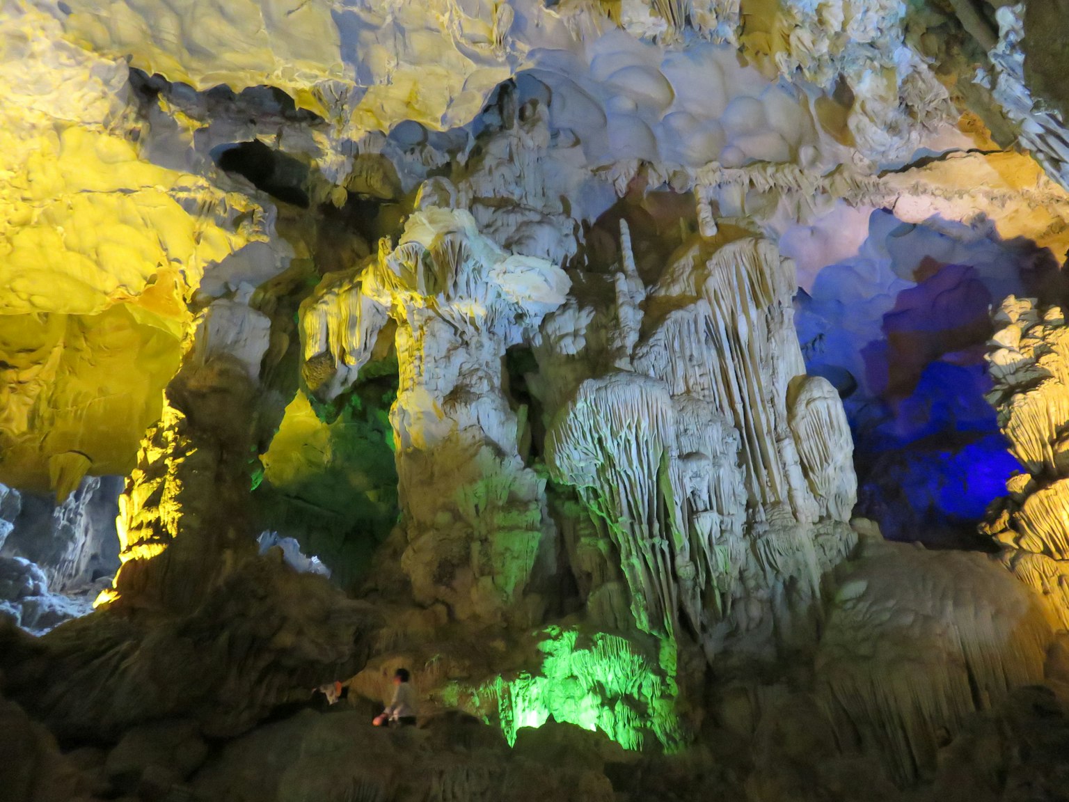Interior of a cave with colorful lighting and unique rock formations