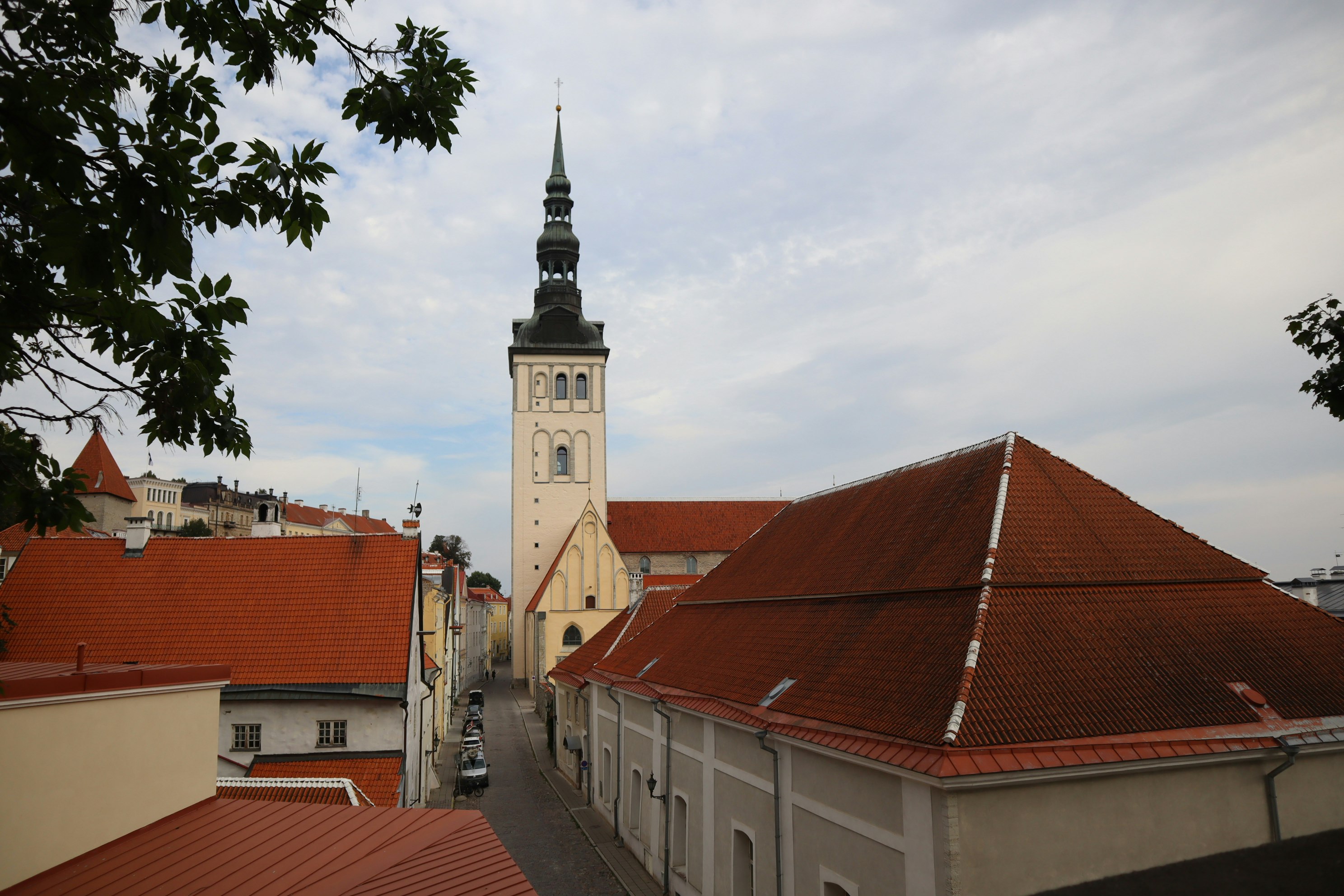 street with red-roof buildings and a church steeple