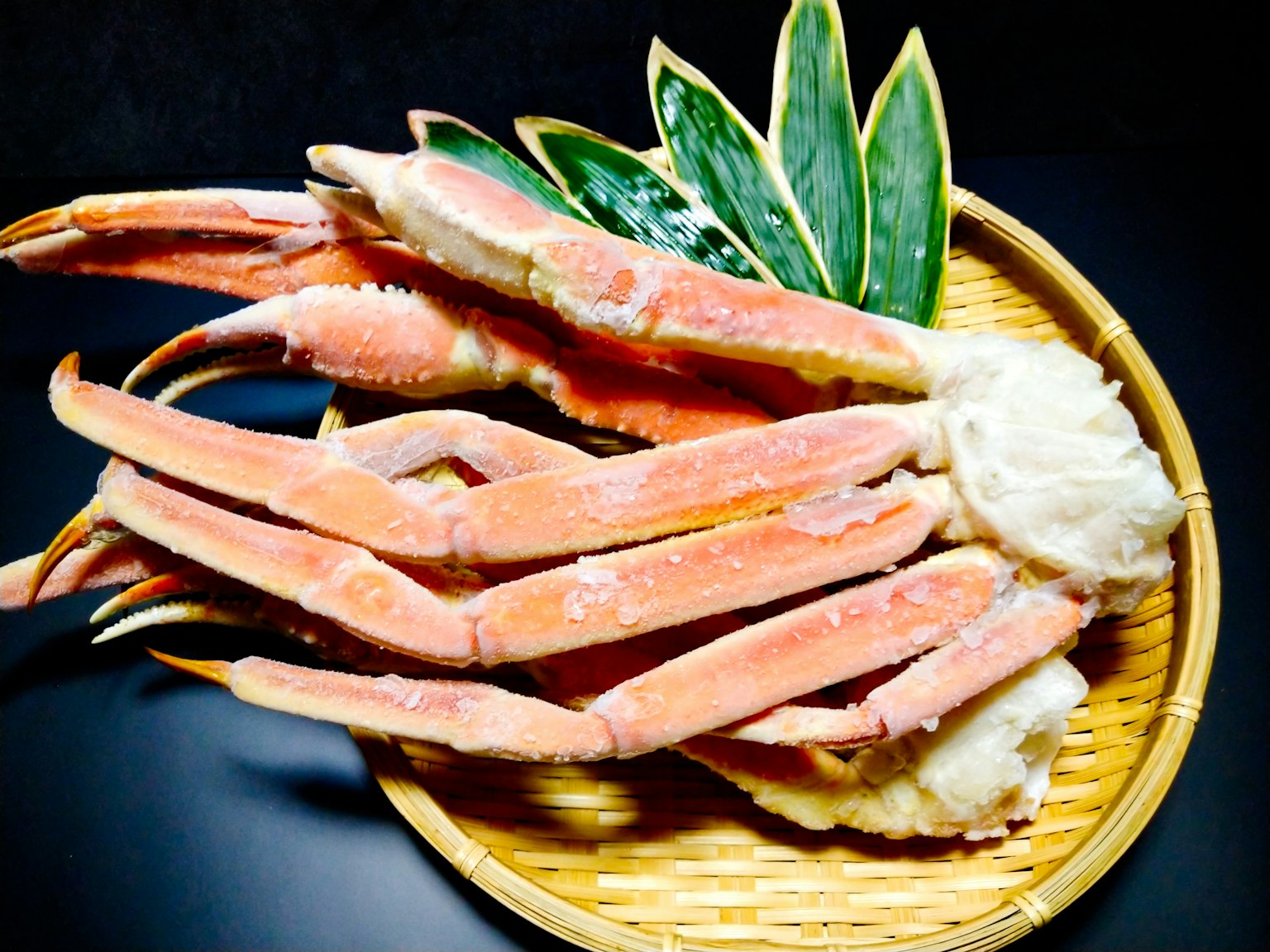 Beautifully arranged crab legs displayed in a basket