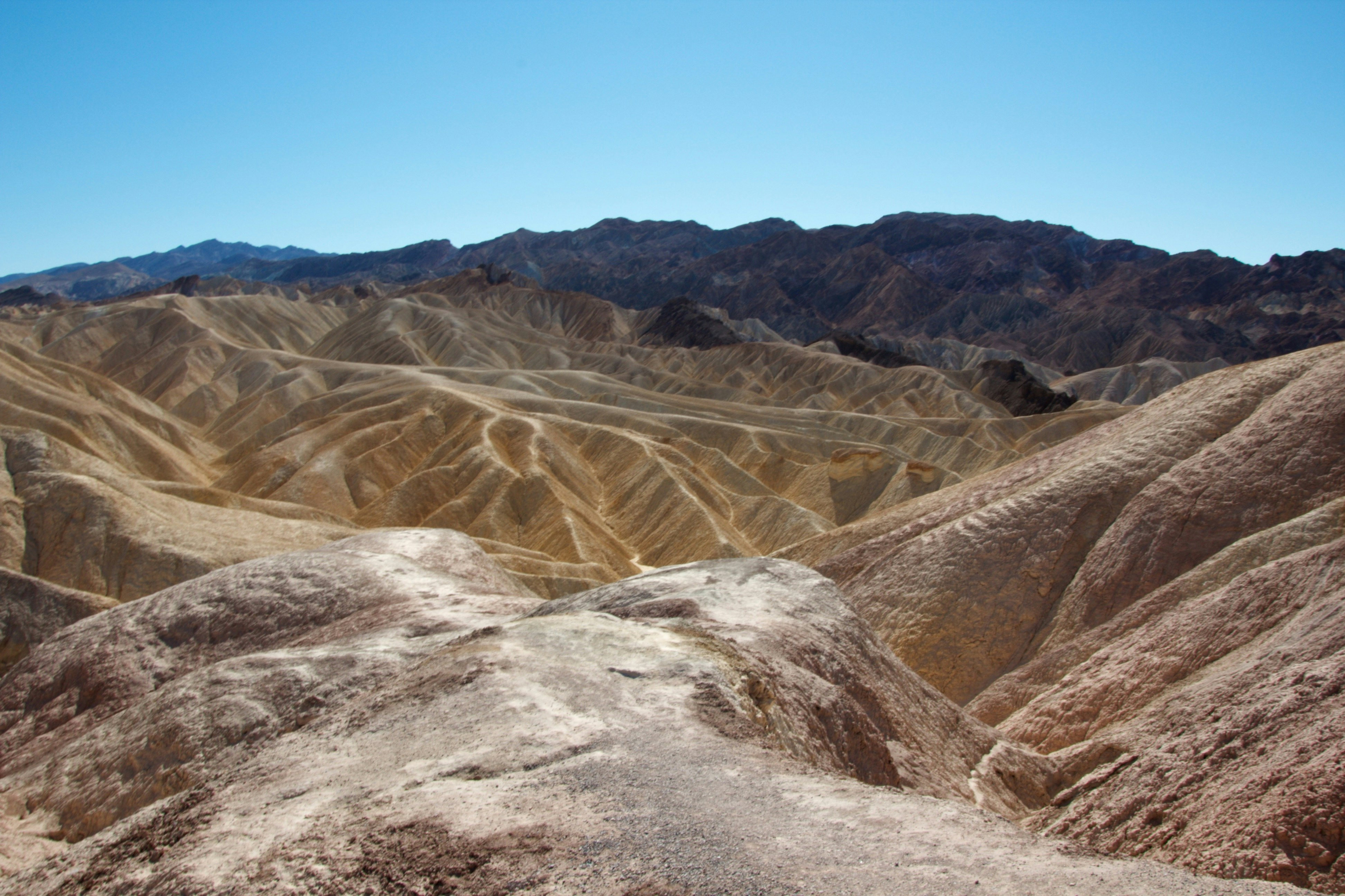 barren mountain slopes and winding valleys landscape