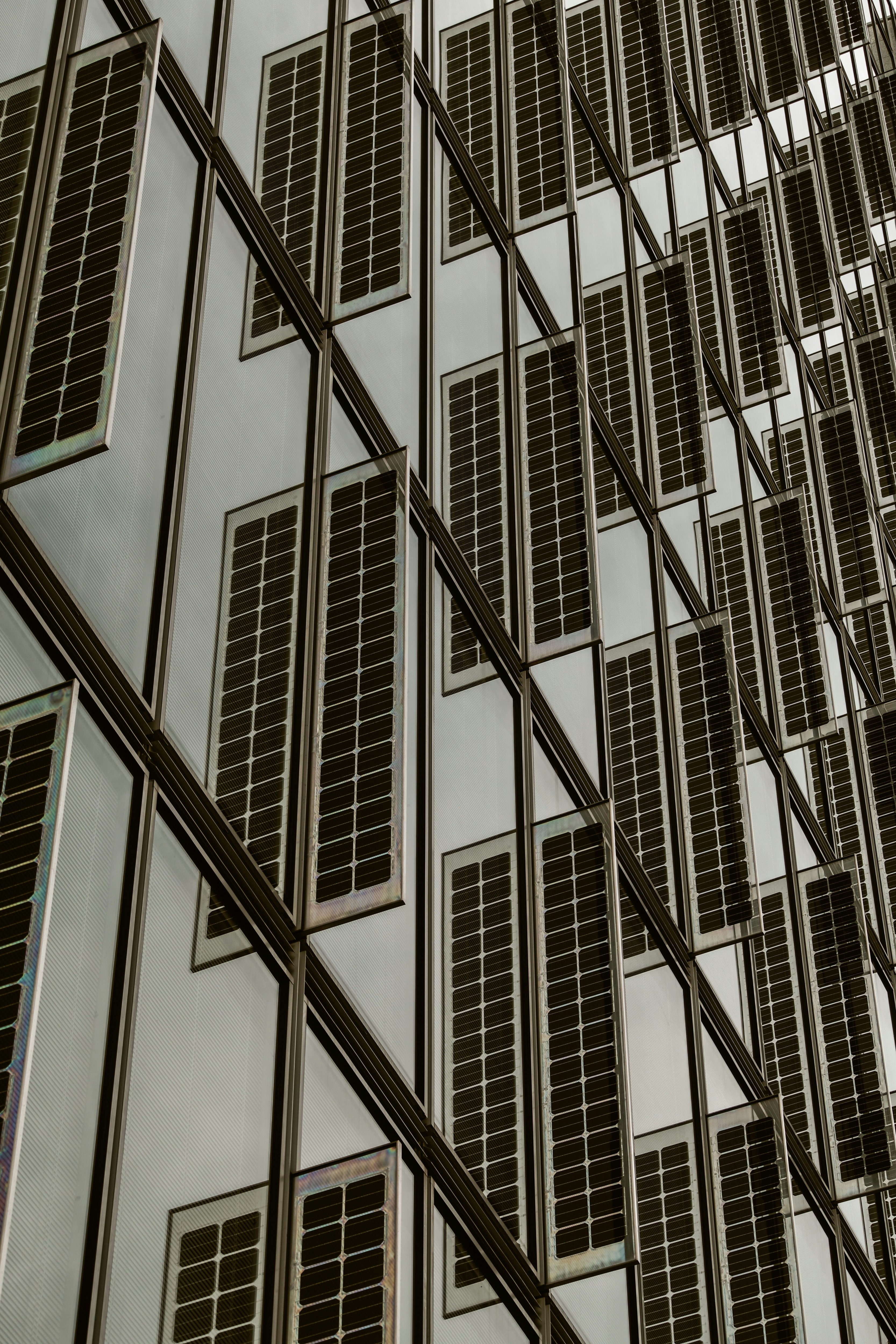 urban building facade with rows of solar panels