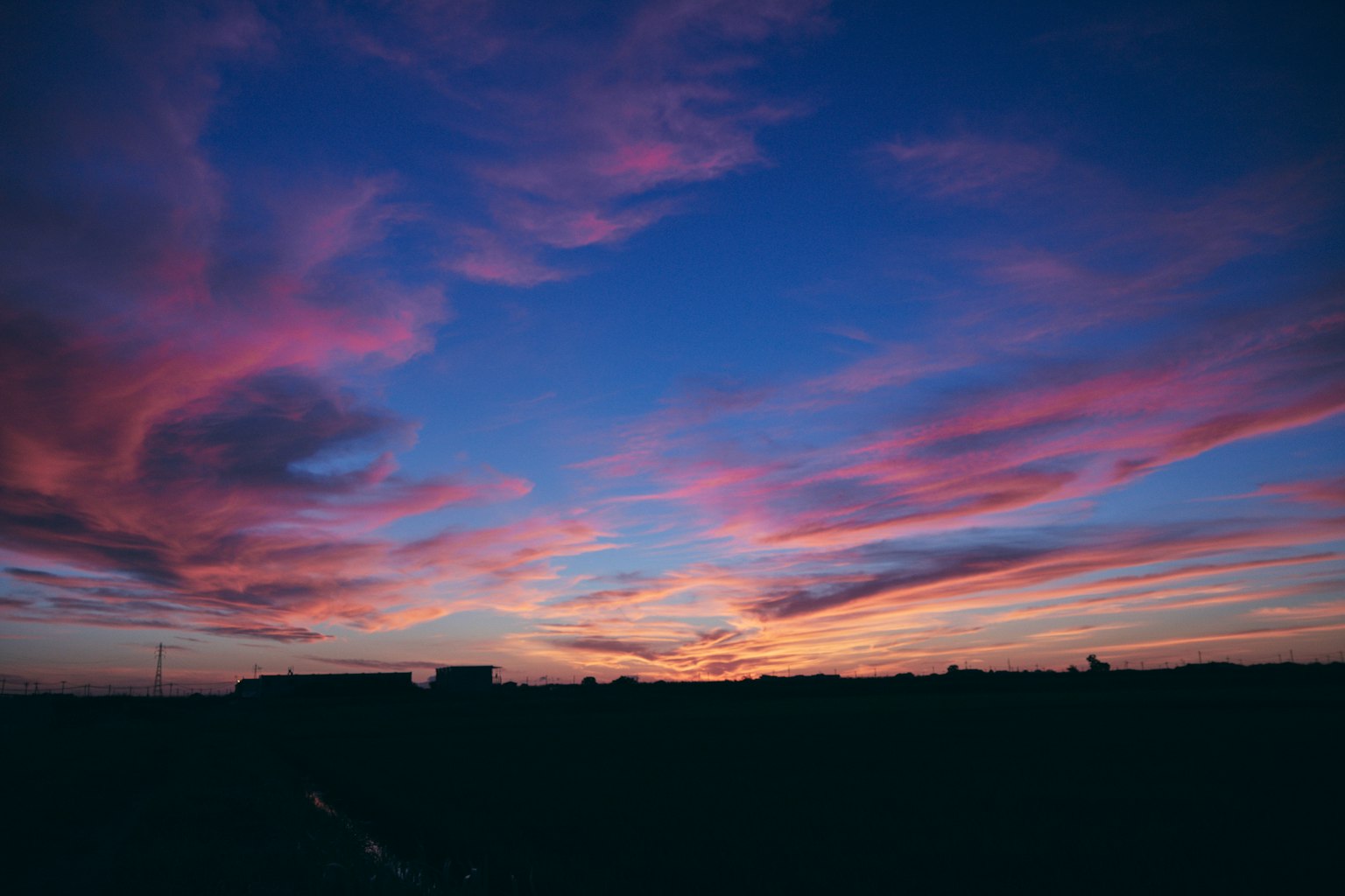 Beautiful sunset sky with pink and blue clouds