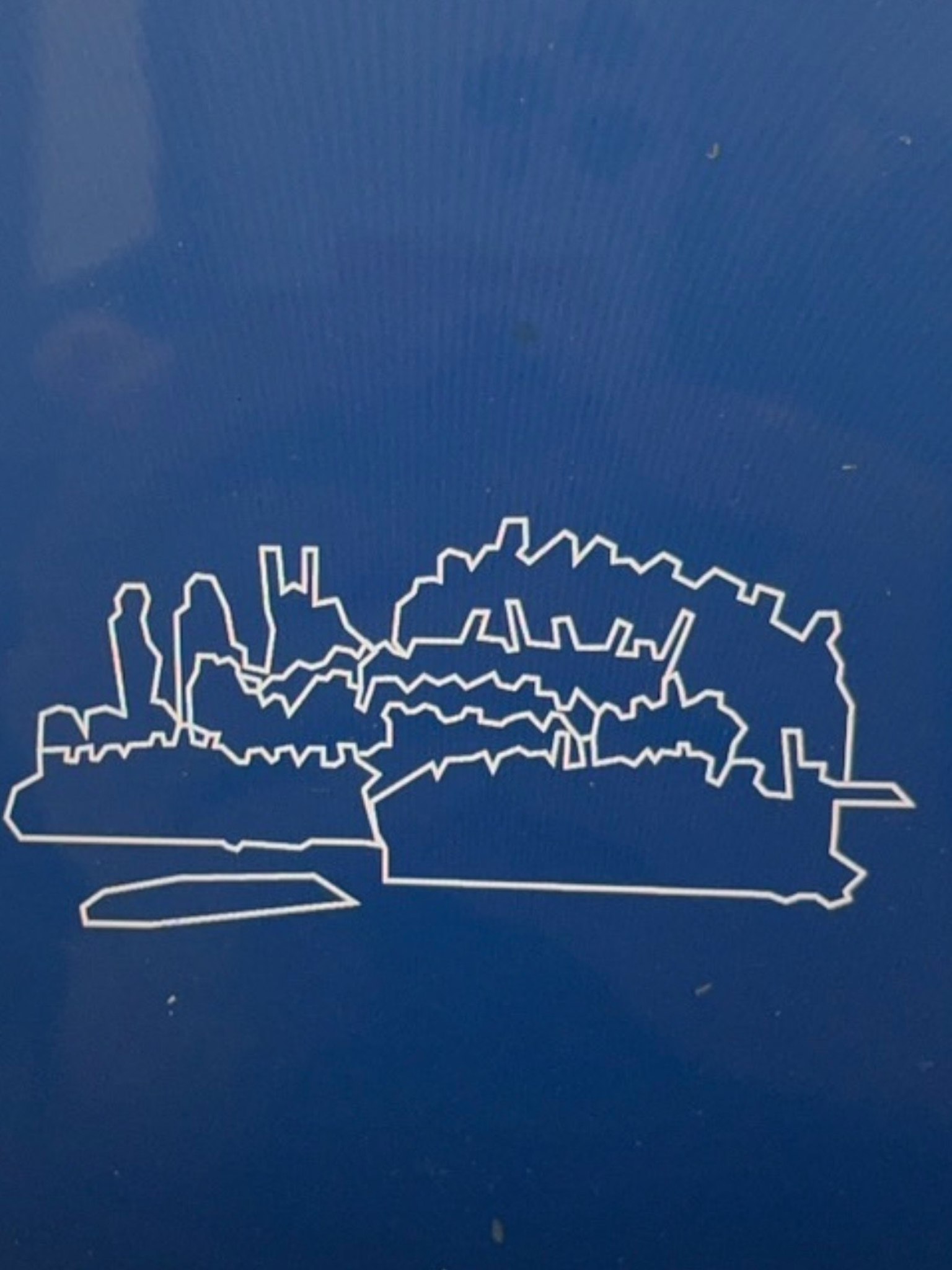 Image of a white silhouette of a ship against a blue background