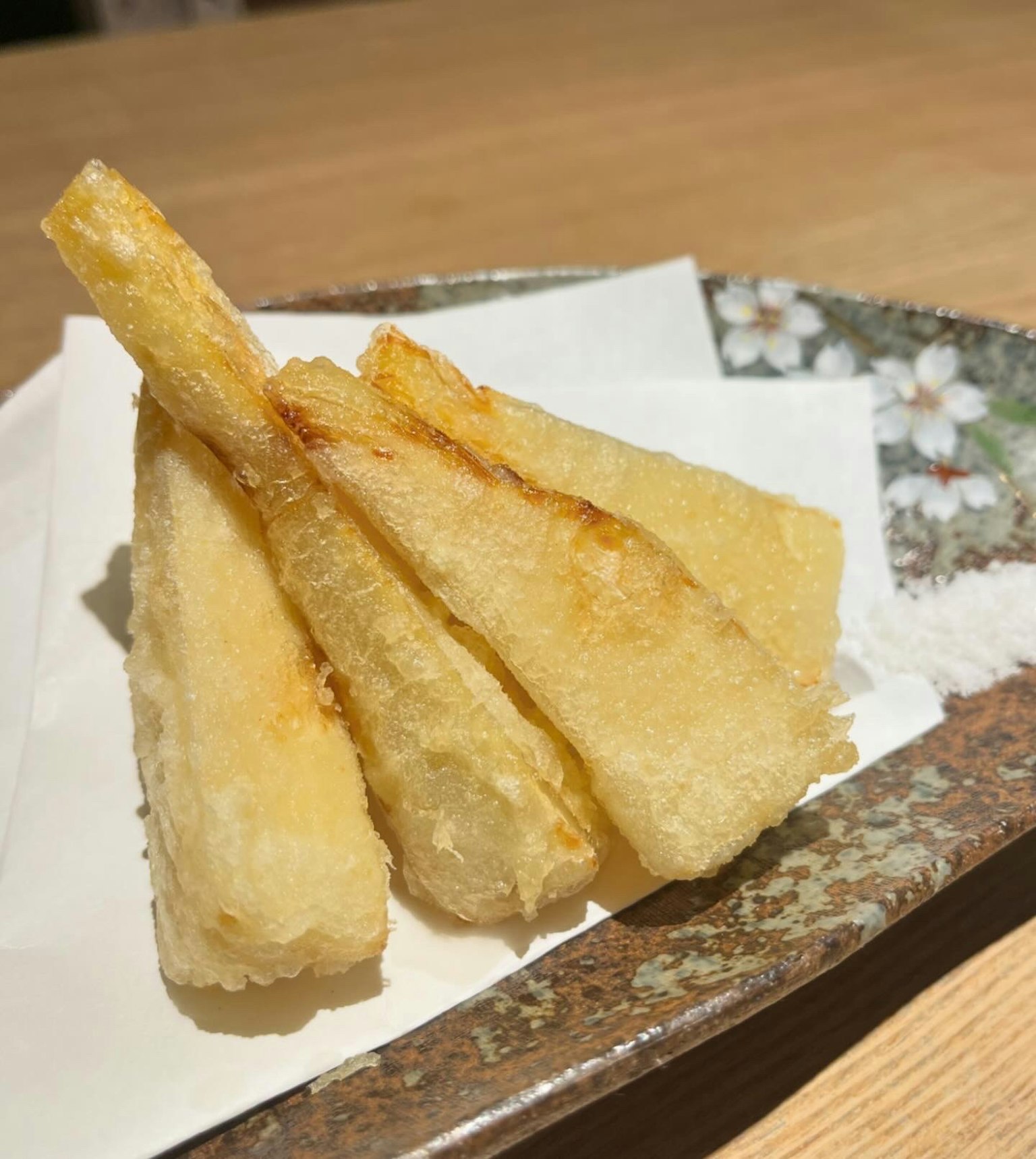 Beautifully plated fried root vegetables on a traditional dish