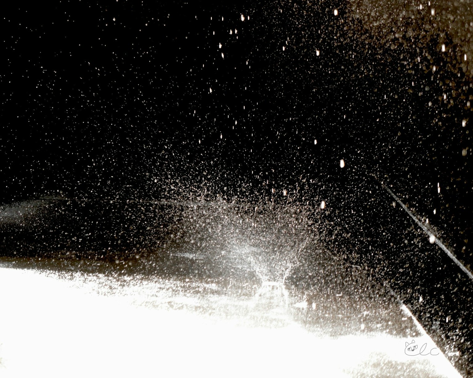 White water spray against a dark background