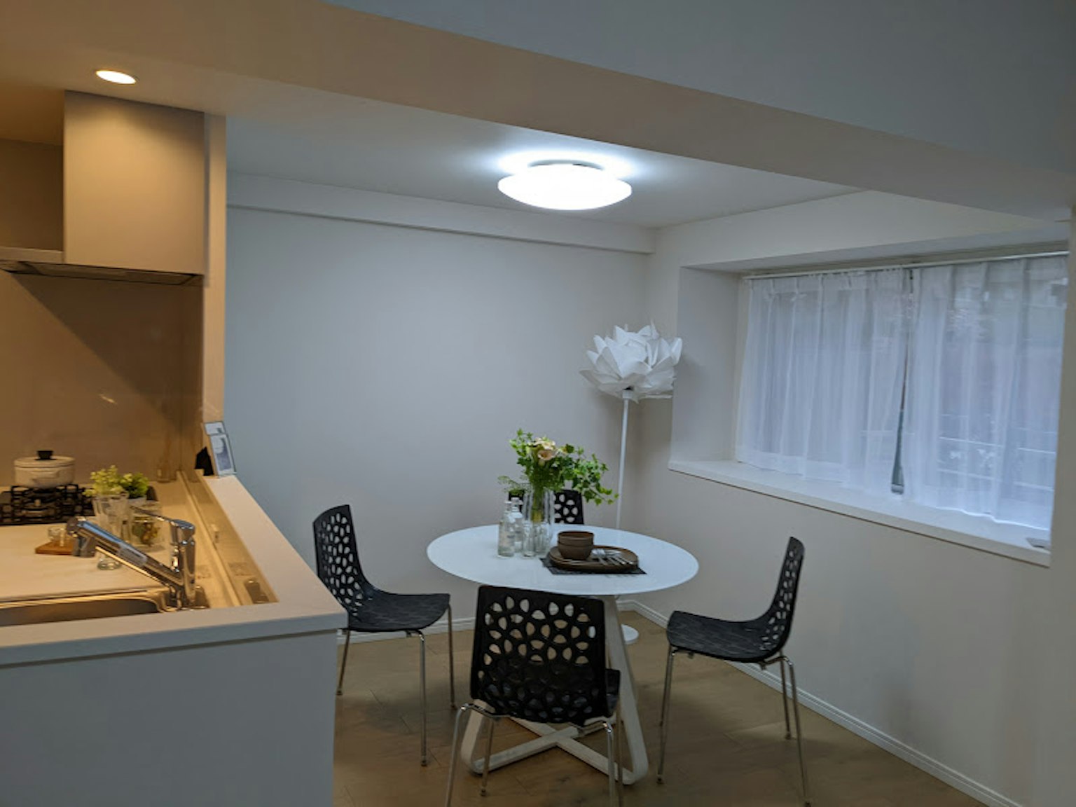 Bright kitchen and dining area with simple design