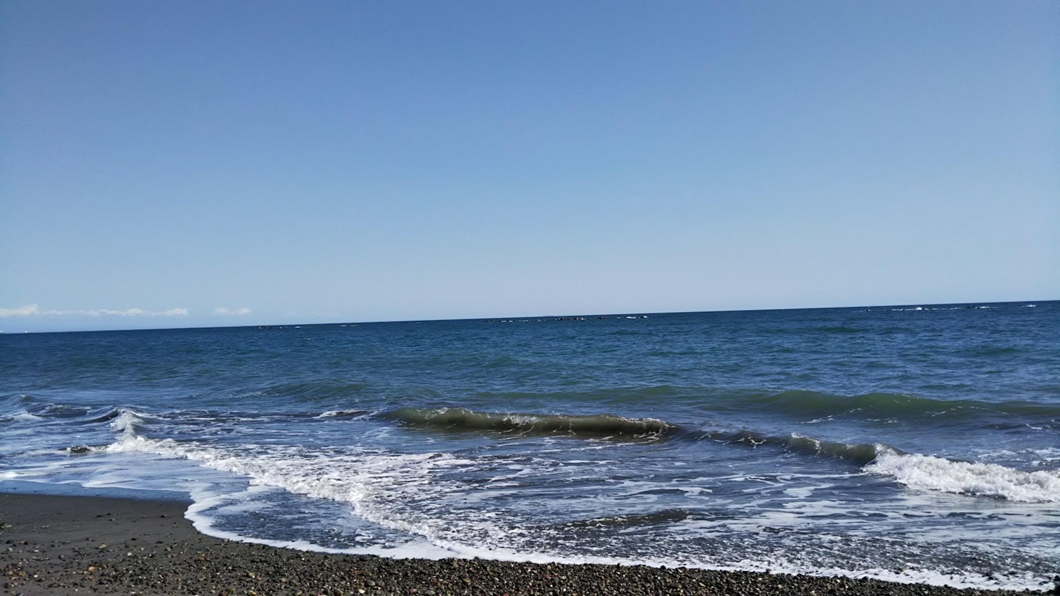 Scenic view of a blue ocean with gentle waves