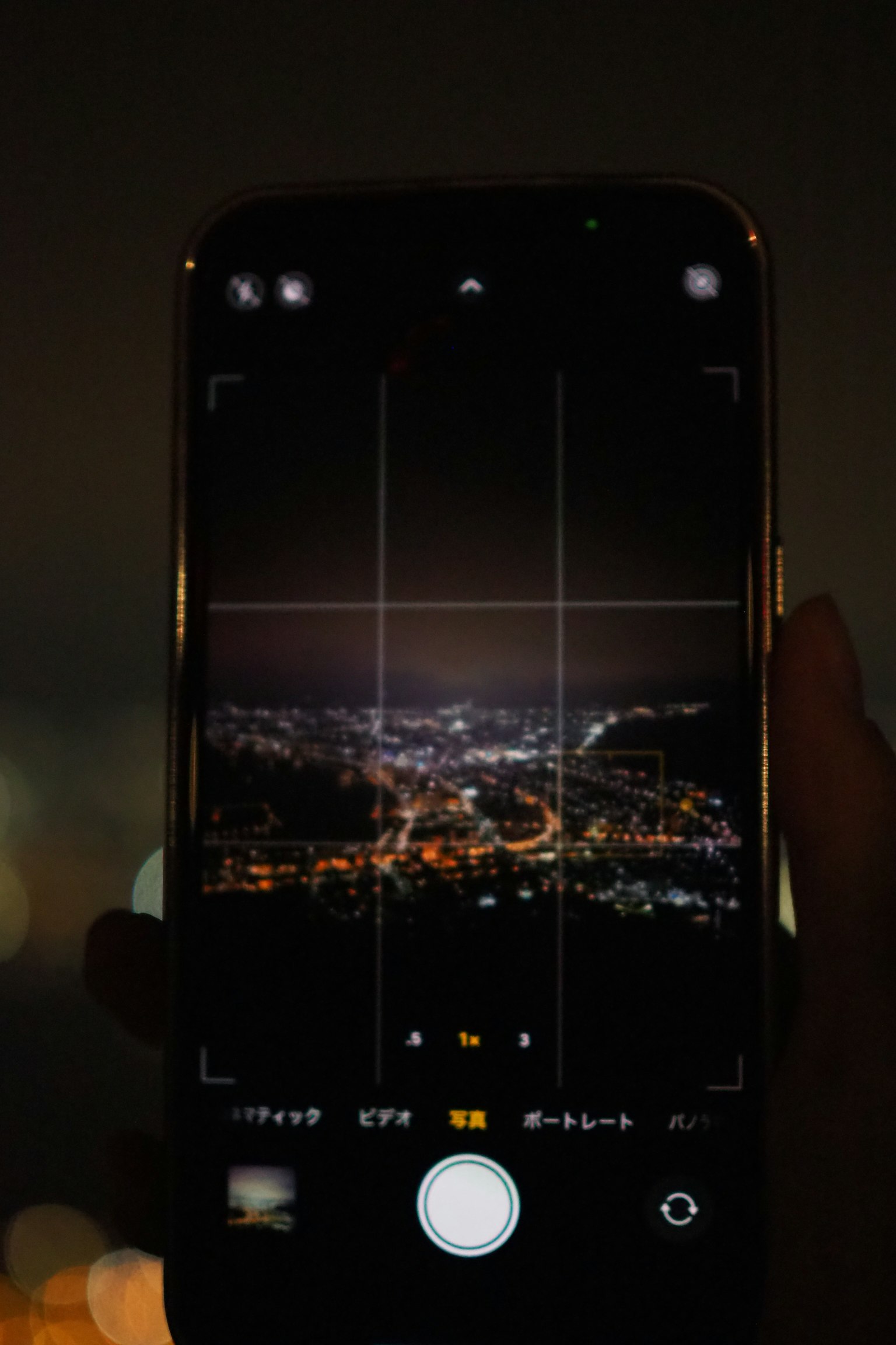 Camera app screen of a smartphone capturing a night view