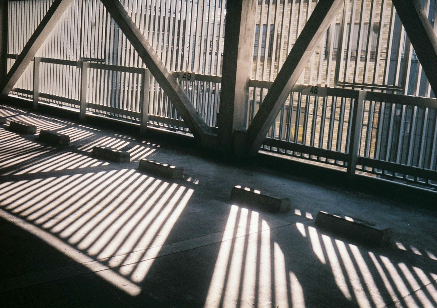 Interior of an industrial space with intersecting light and shadow