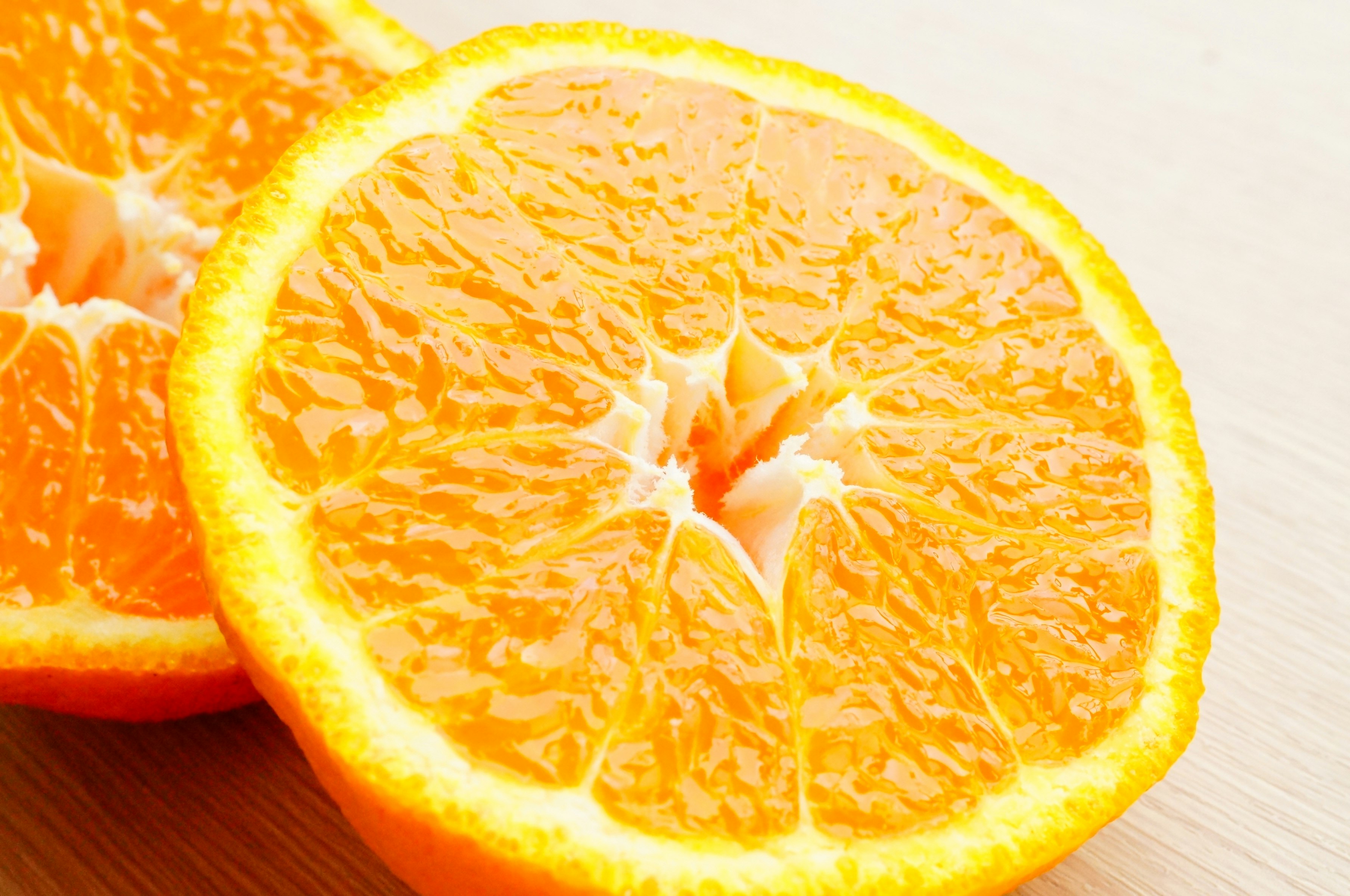 Close-up of sliced orange and juicy segments
