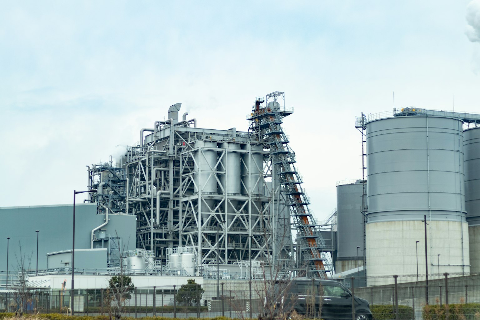 Industrial facility with complex structures and steel tanks