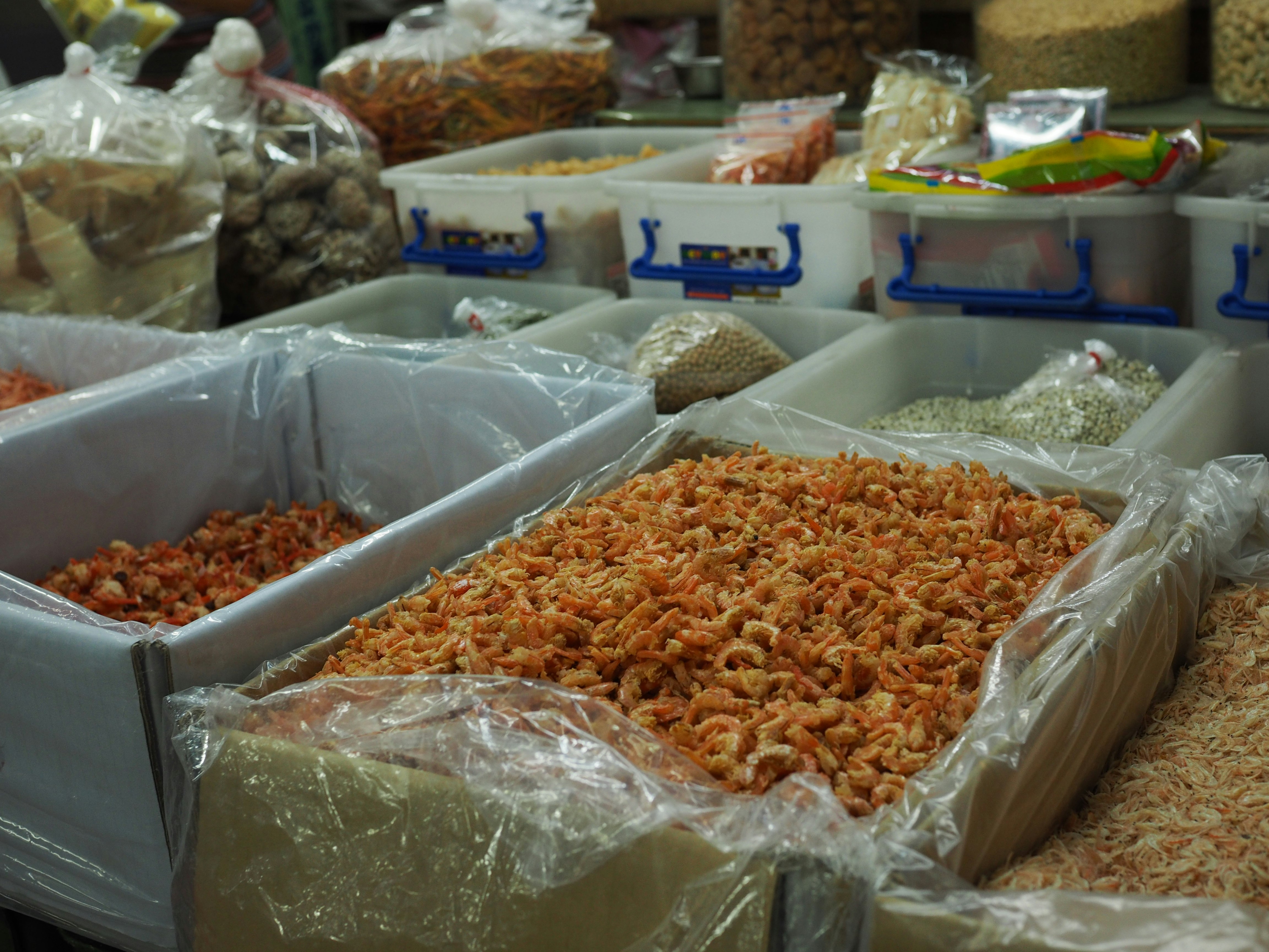 indoor display of dried foods and spices in plastic bags