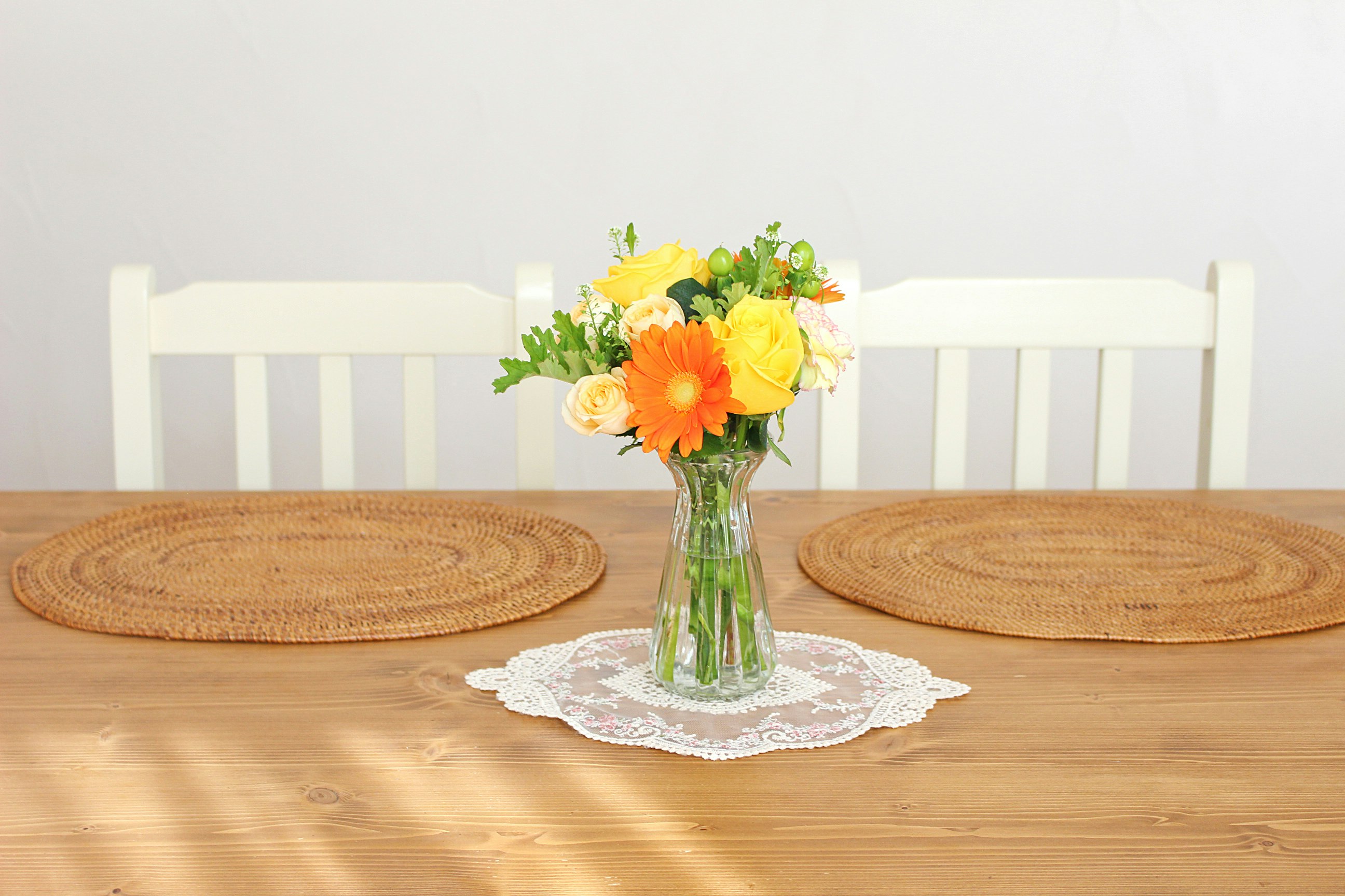 Wooden table centerpiece with a vase and flowers