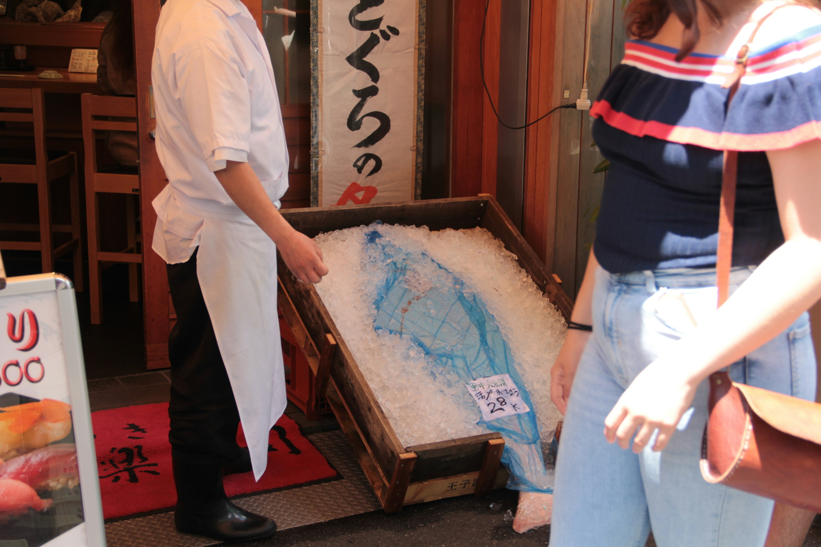 Blue map on tatami with people working
