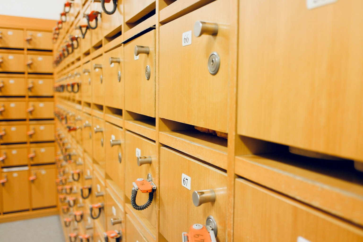 Interior of a storage cabinet with wooden drawers