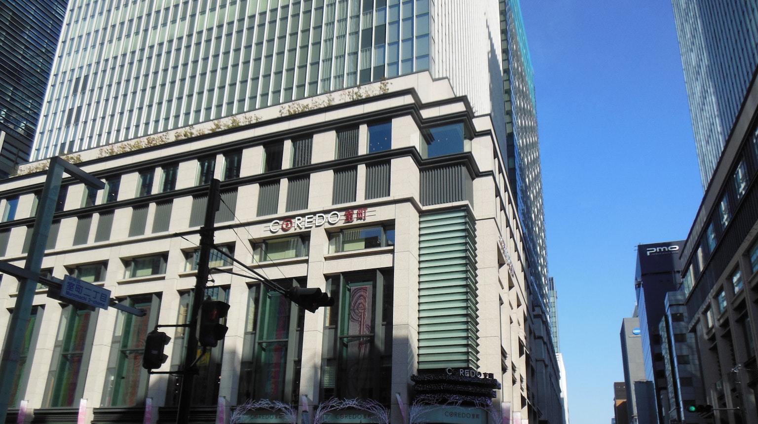 Facade of a tall building with a clear blue sky