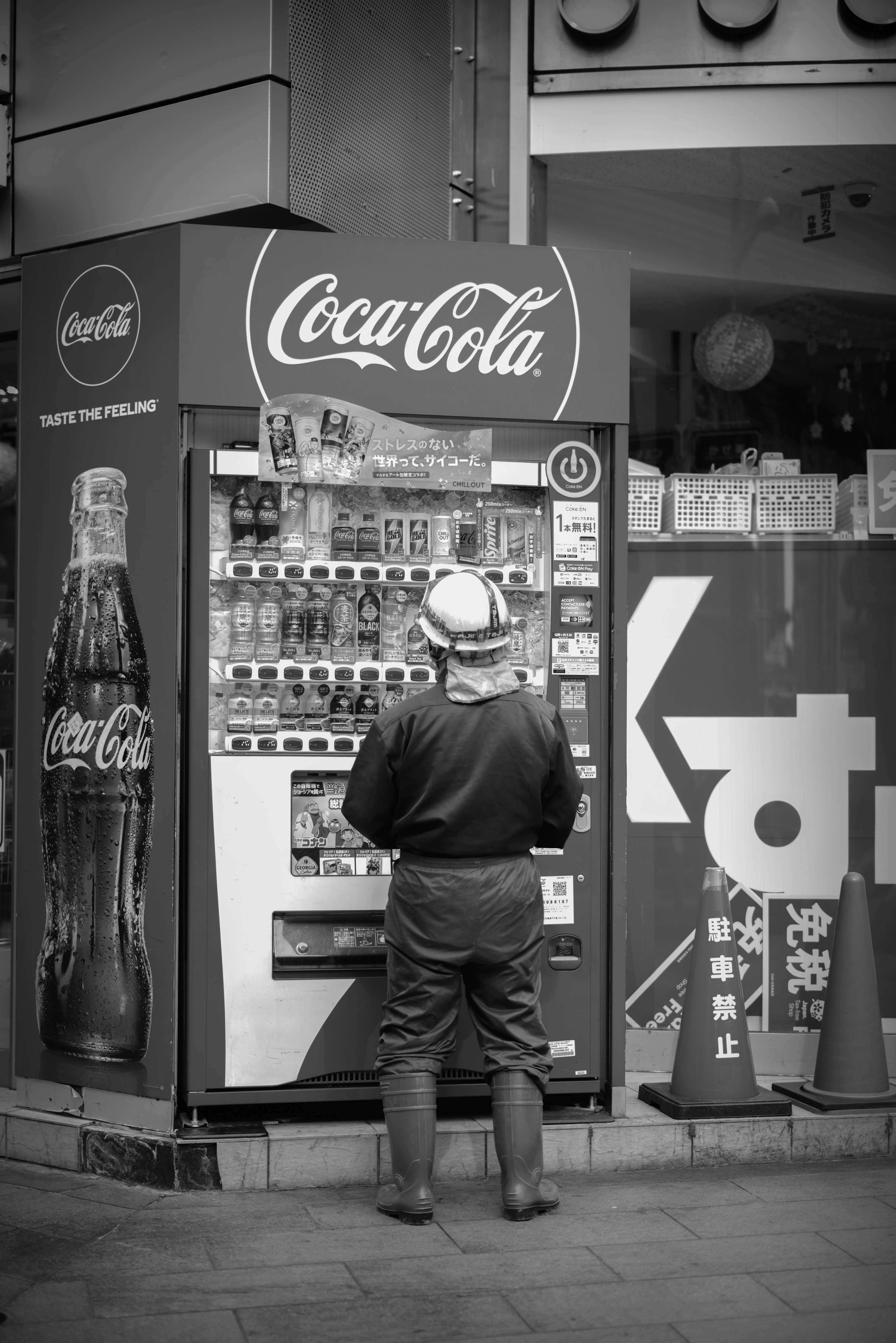 Coca-Cola vending machine and signage on a street corner