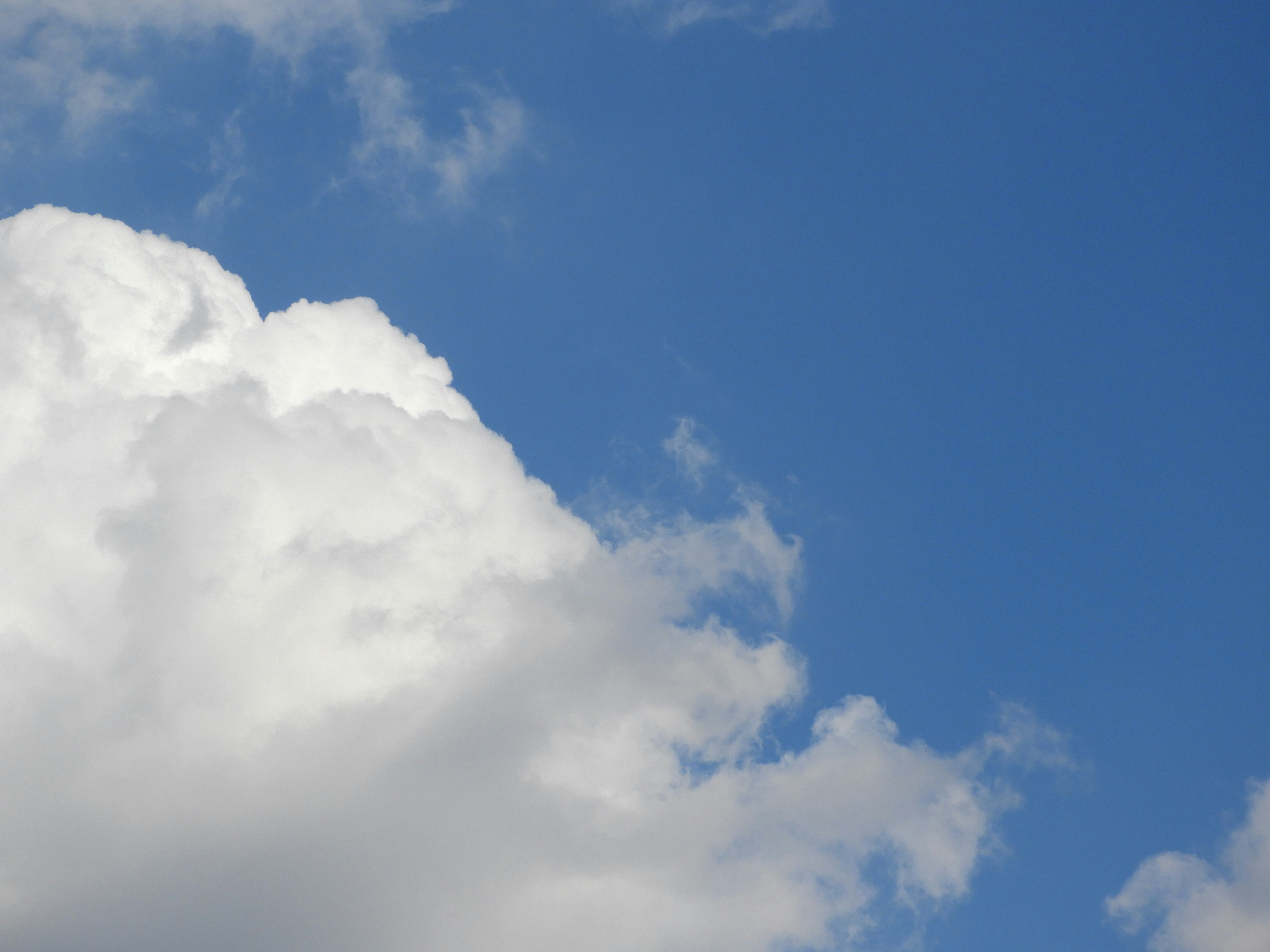 clouds drifting across a blue sky