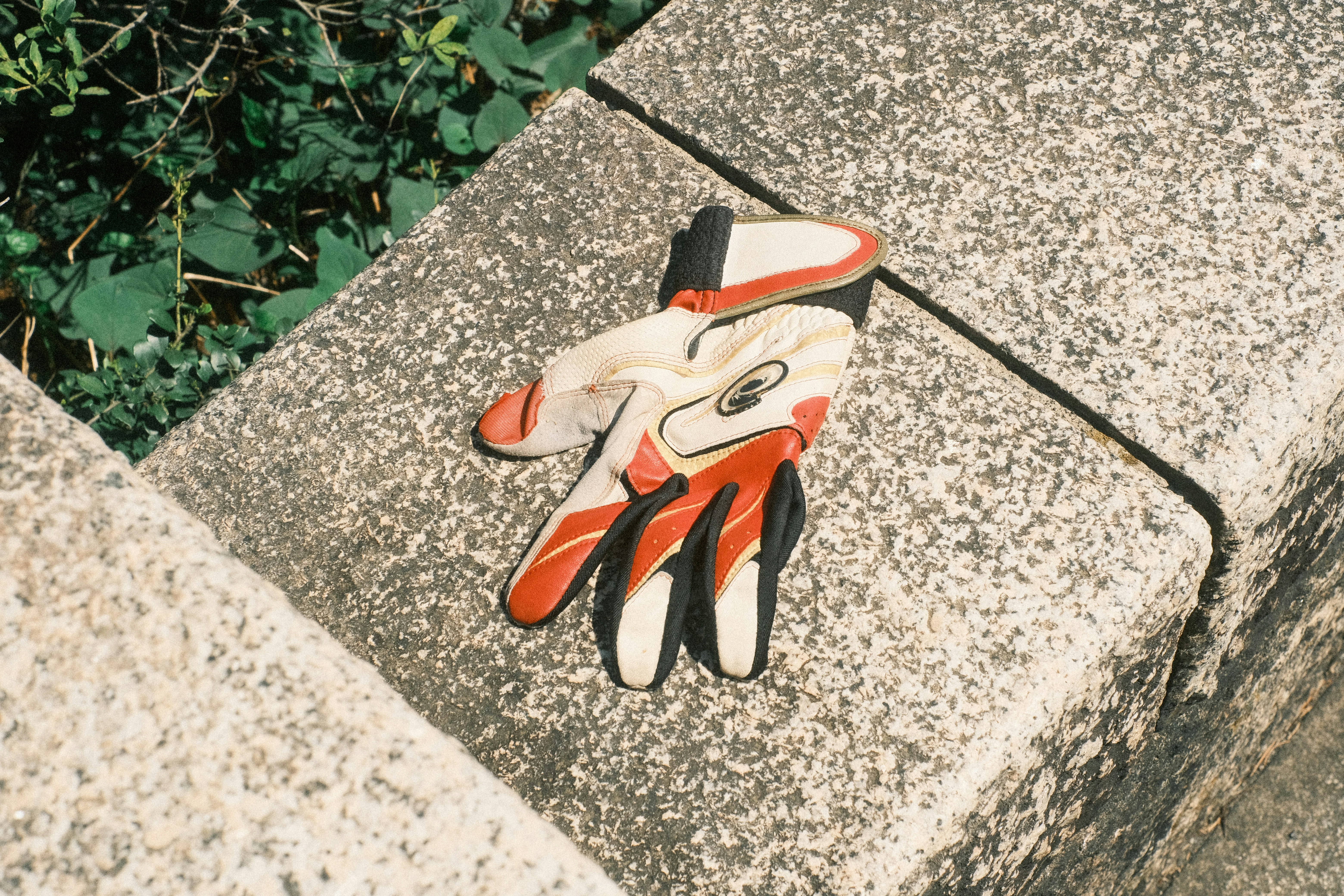 work gloves resting on a stone edge