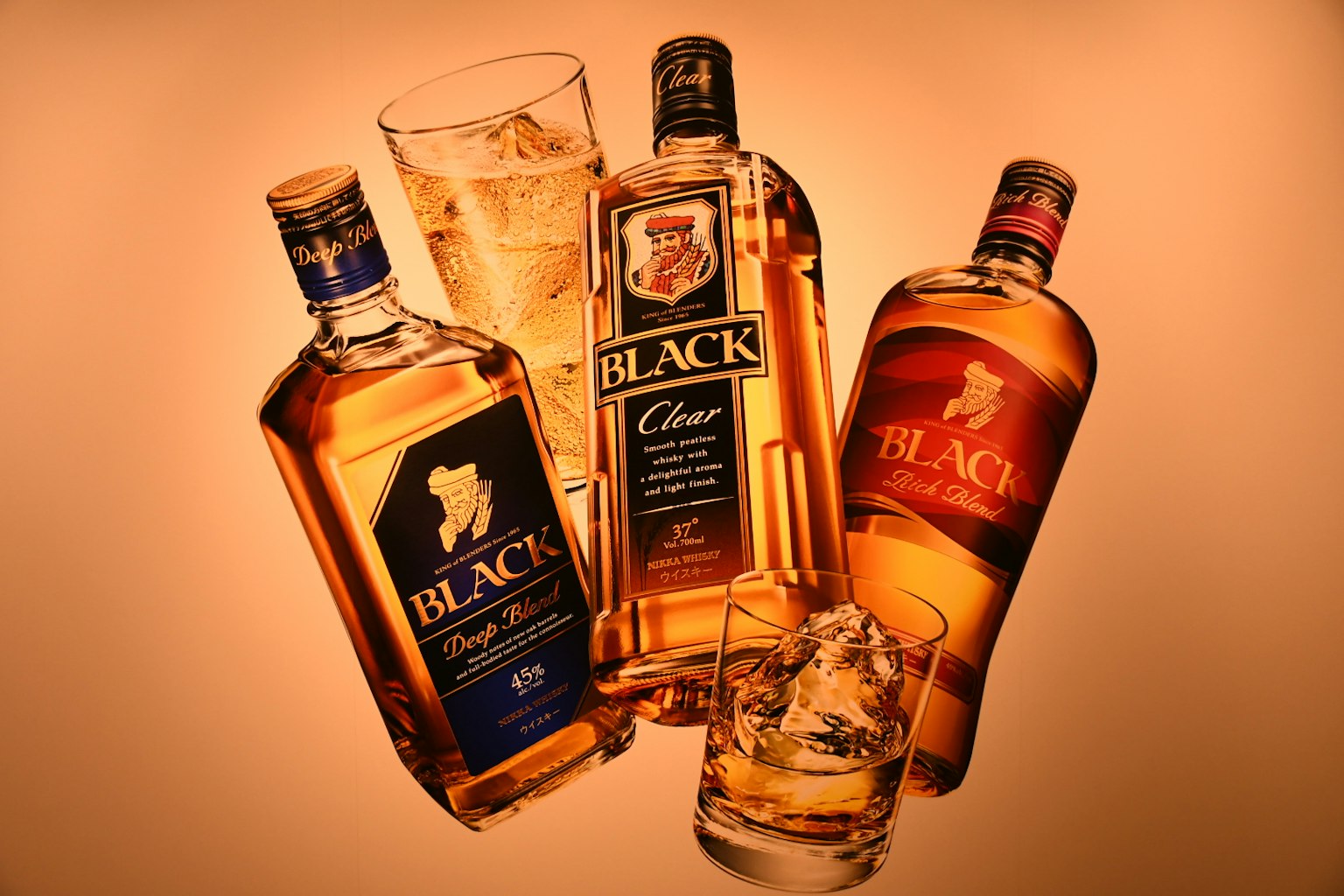 Image of whiskey bottles displayed with a glass containing ice