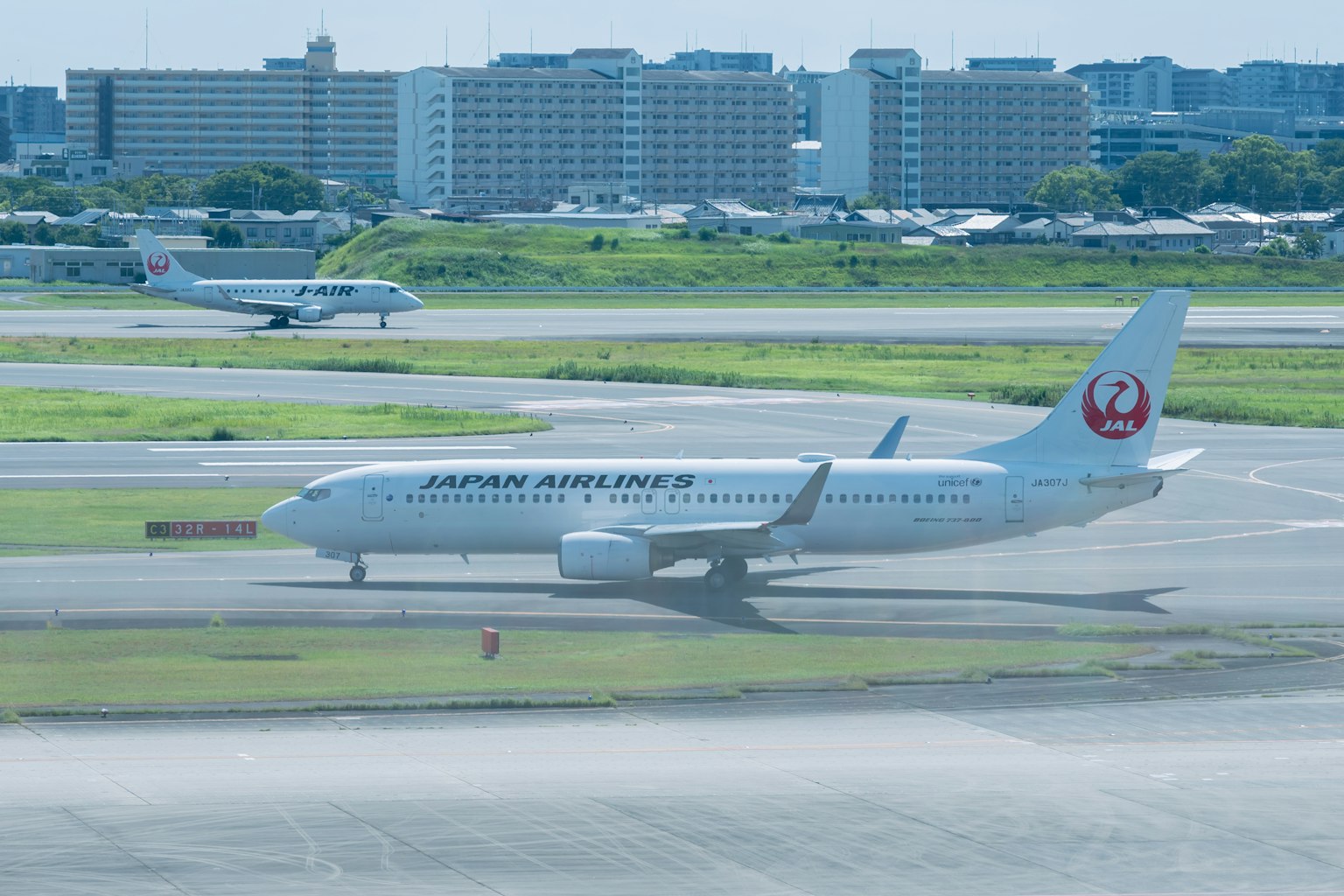 Japan Airlines aircraft taxiing on the runway