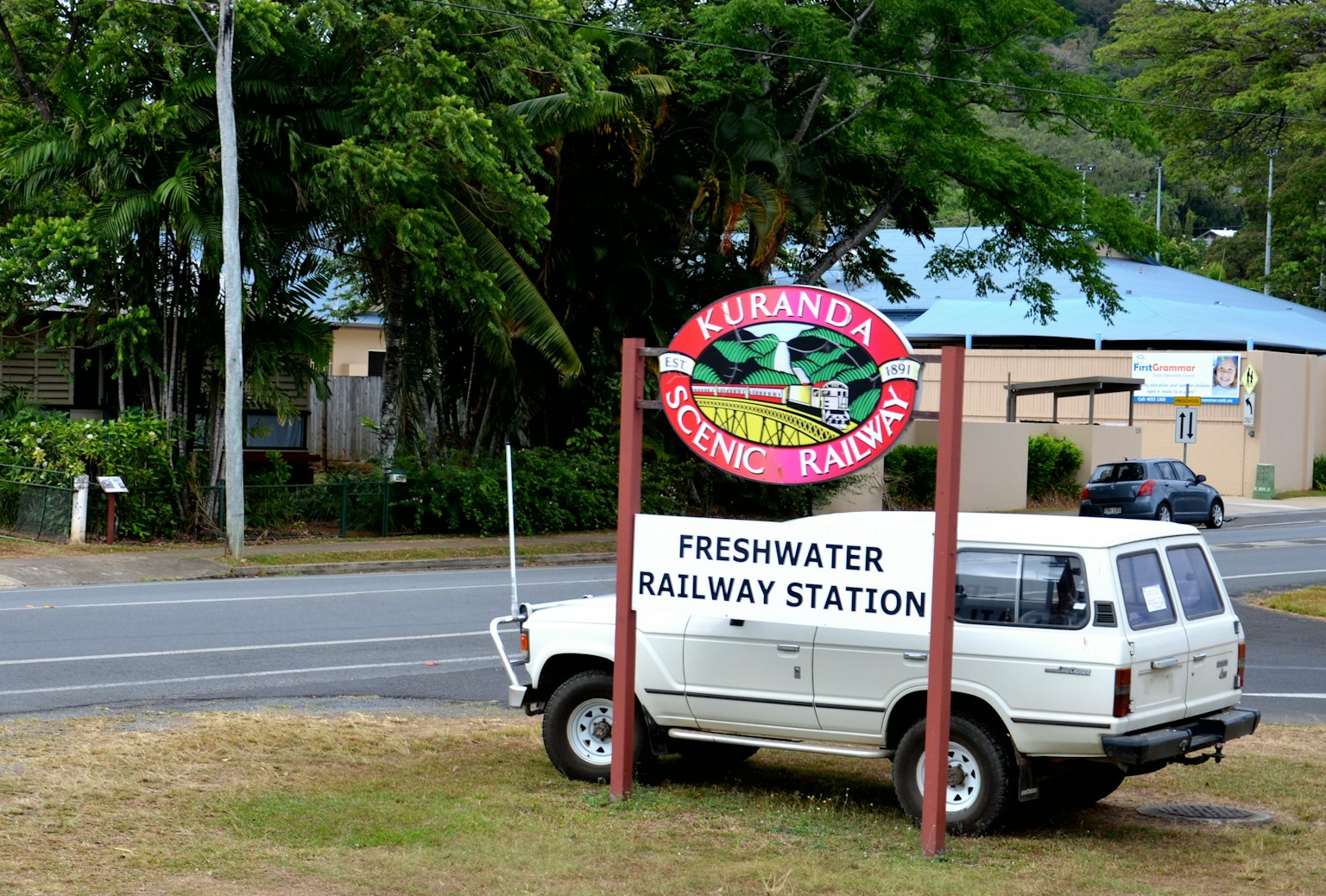 Freshwater Railway Station sign with a white vehicle parked nearby