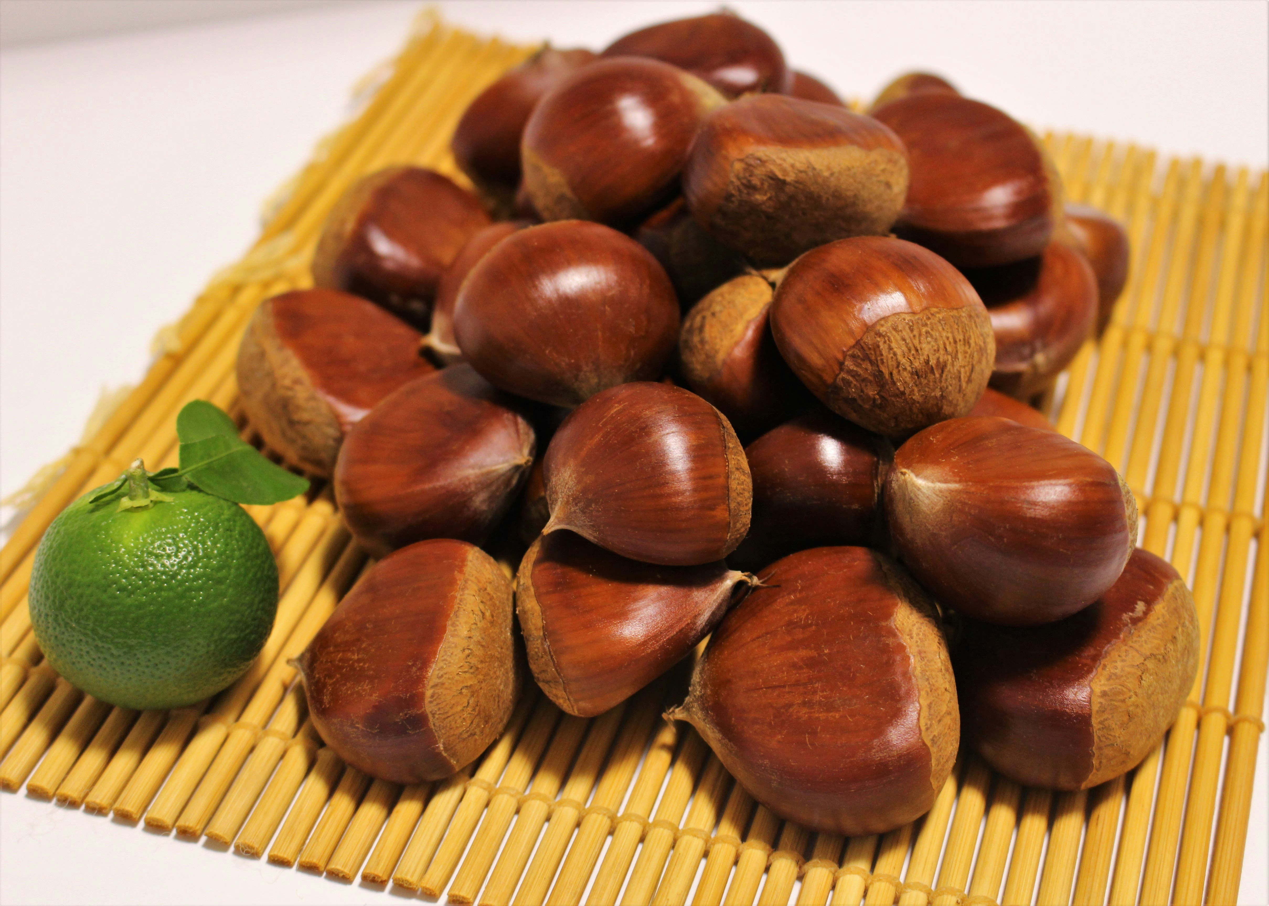 acorn-shaped pastries on a bamboo mat