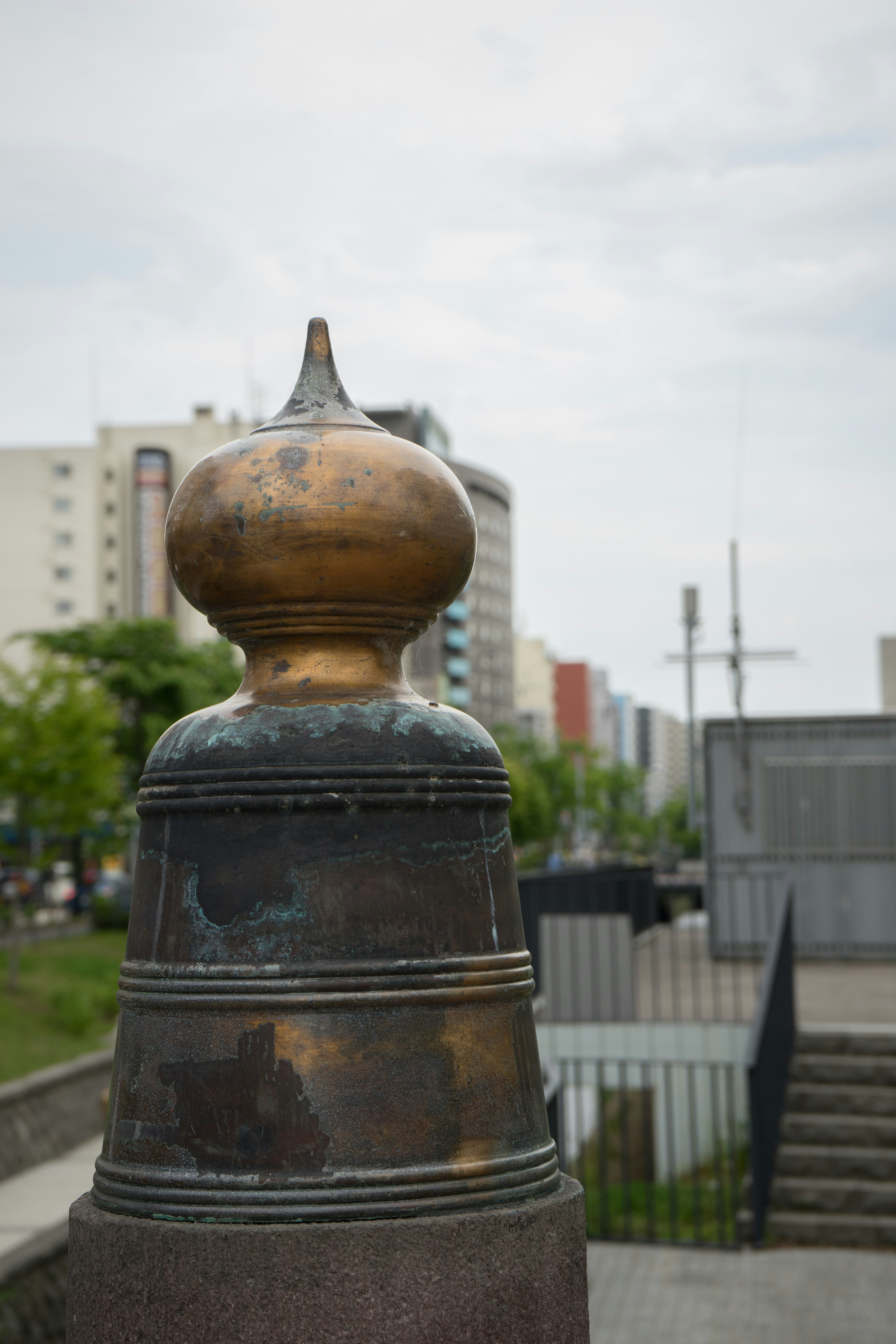 metal decorative post cap on an outdoor railing