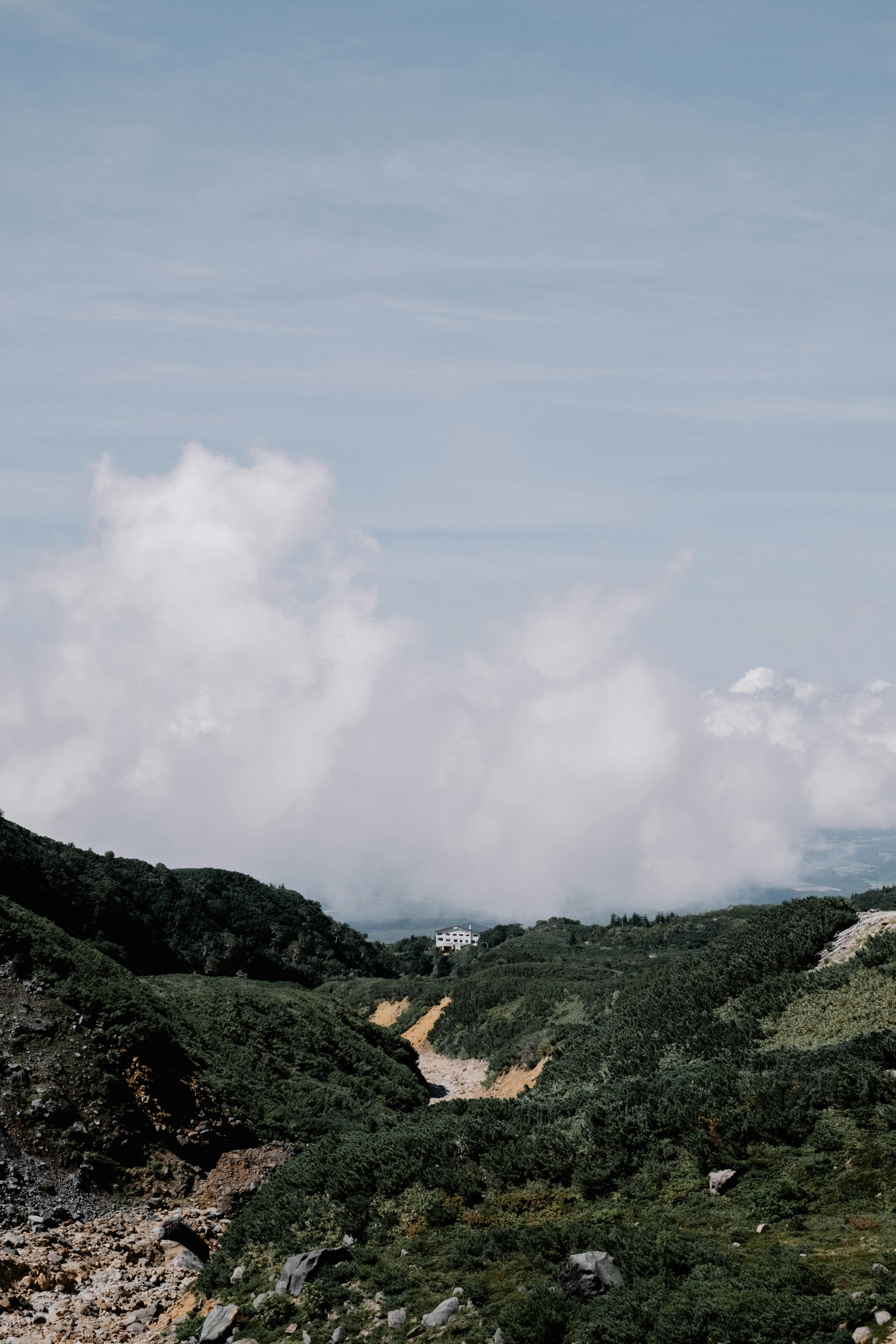 valley landscape with green hills and rocky terrain