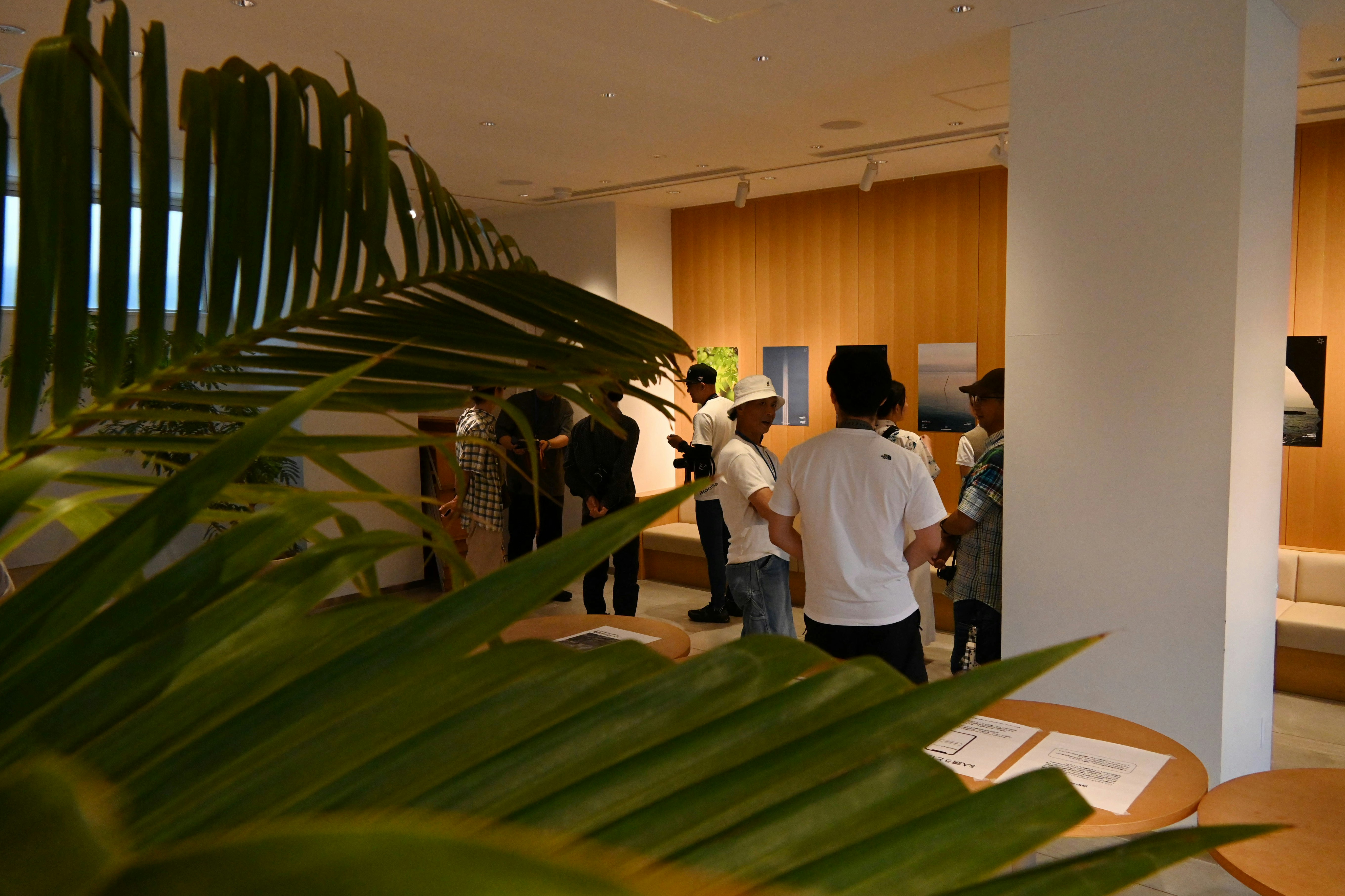 People viewing artworks in a Kyoto exhibition space