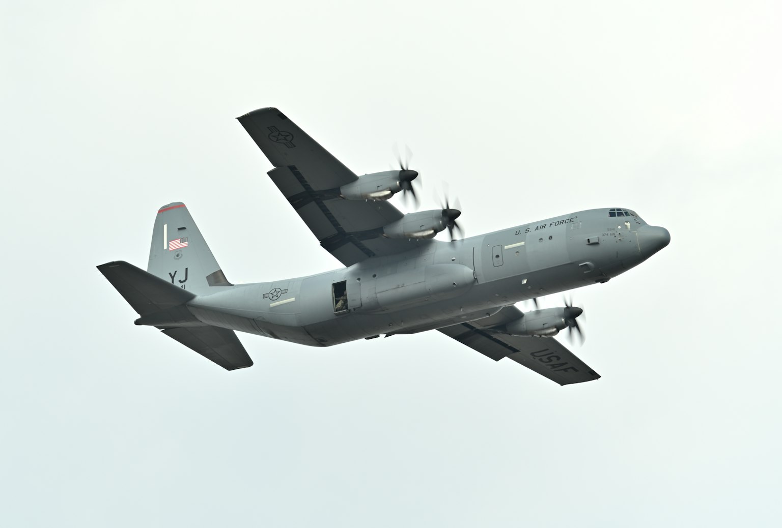 C-130 Hercules military transport aircraft flying in the sky