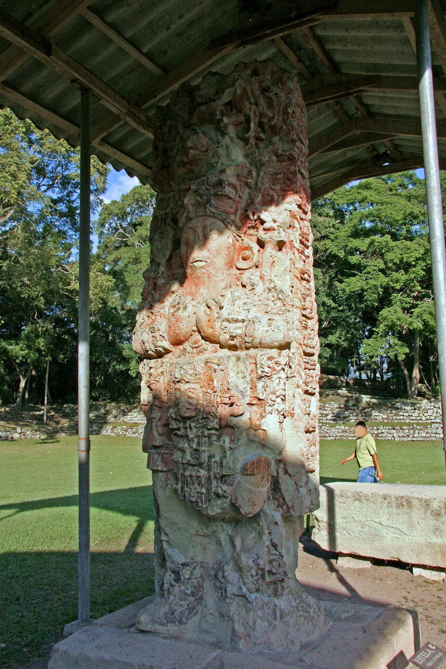 Ancient stone pillar displayed in an archaeological site