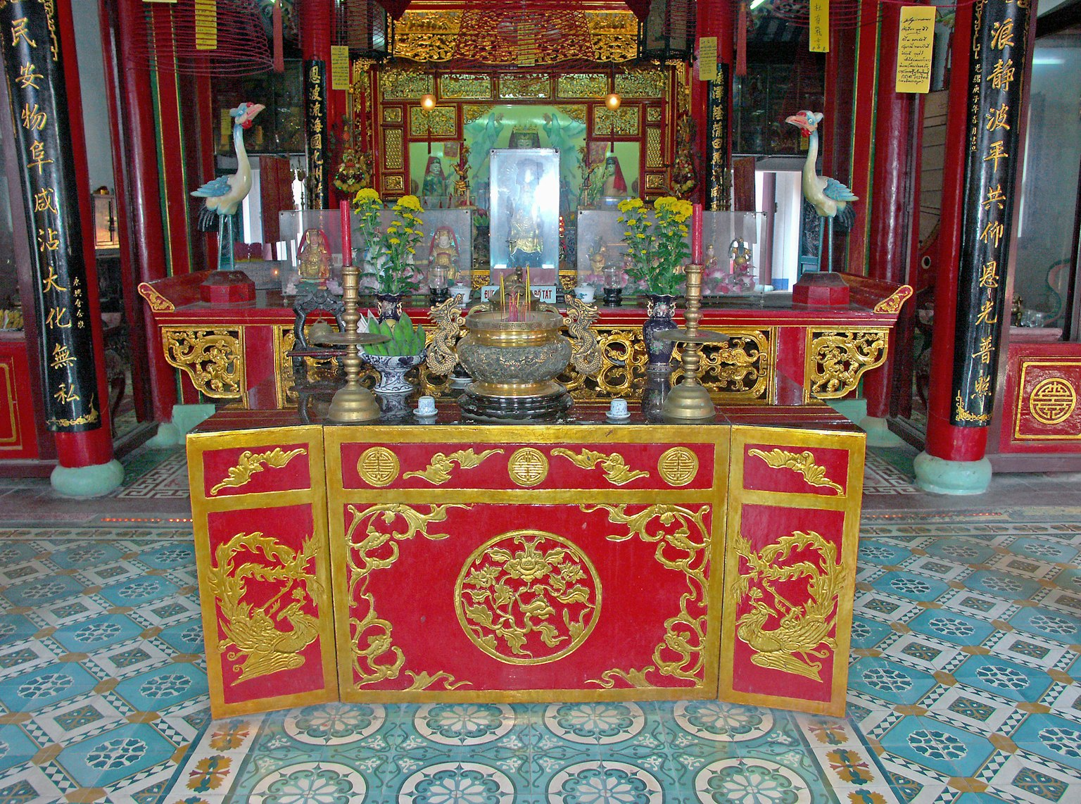 Ornately decorated altar inside a Chinese temple