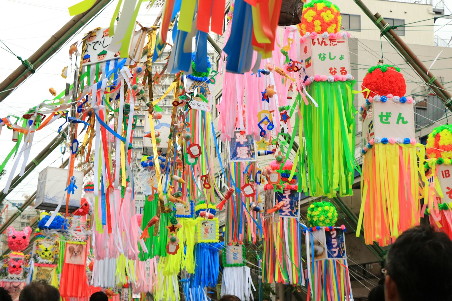 Colorful festival scene with various decorations and ribbons hanging
