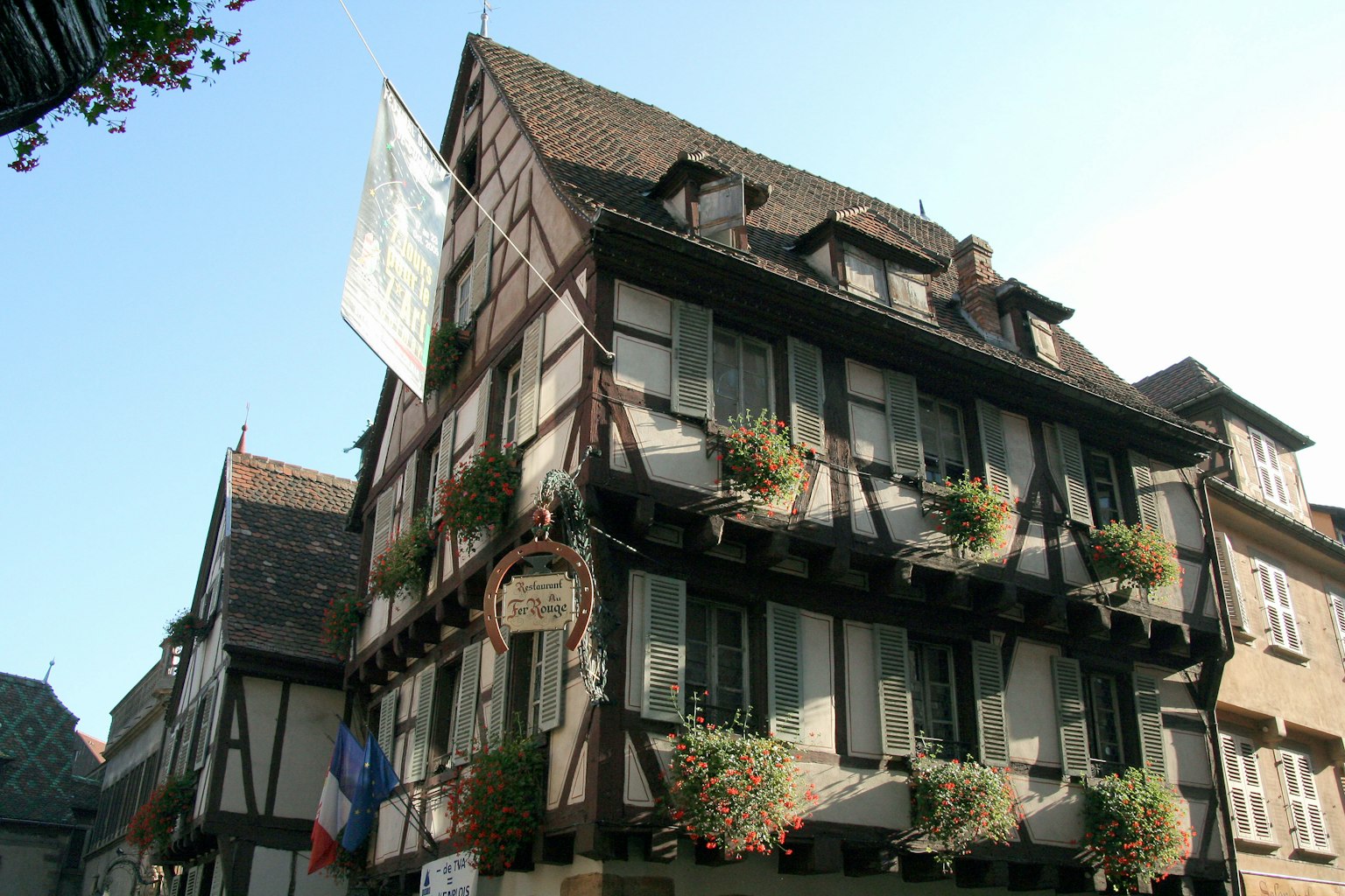 Traditional half-timbered house in Strasbourg with flower boxes