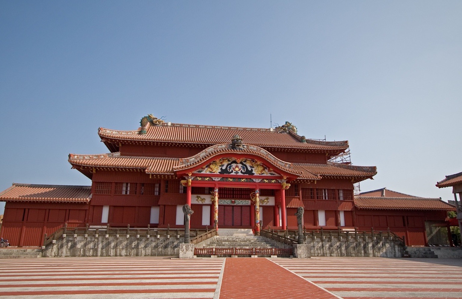 Exterior view of Shuri Castle with vibrant red color