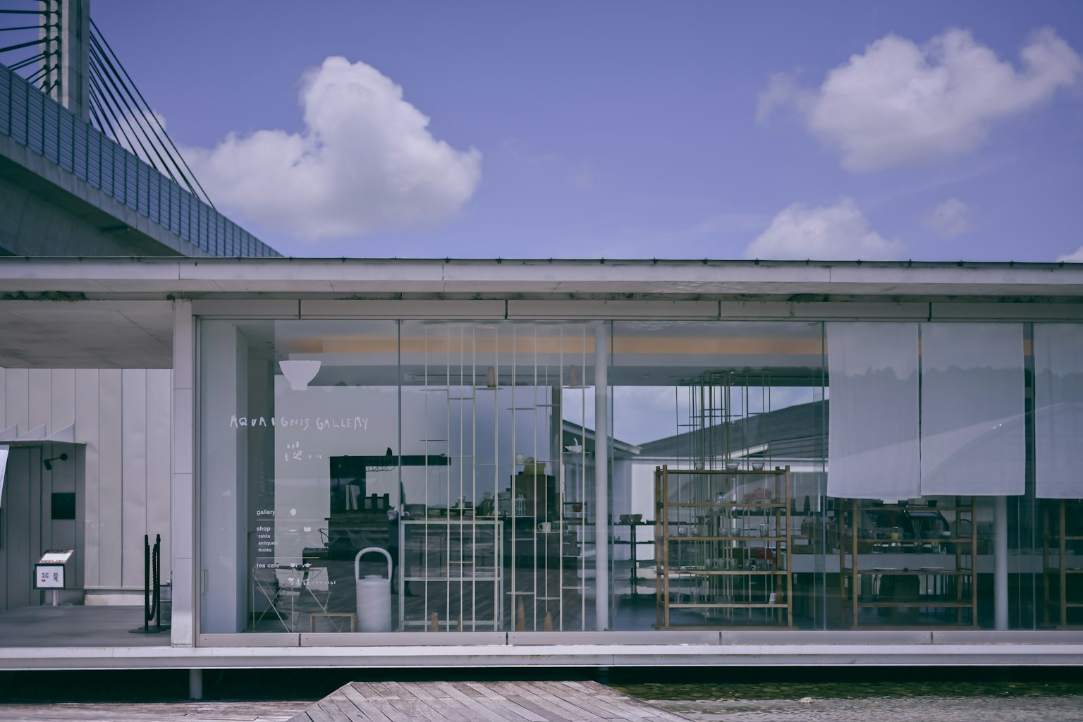 Modern glass building with a clear blue sky