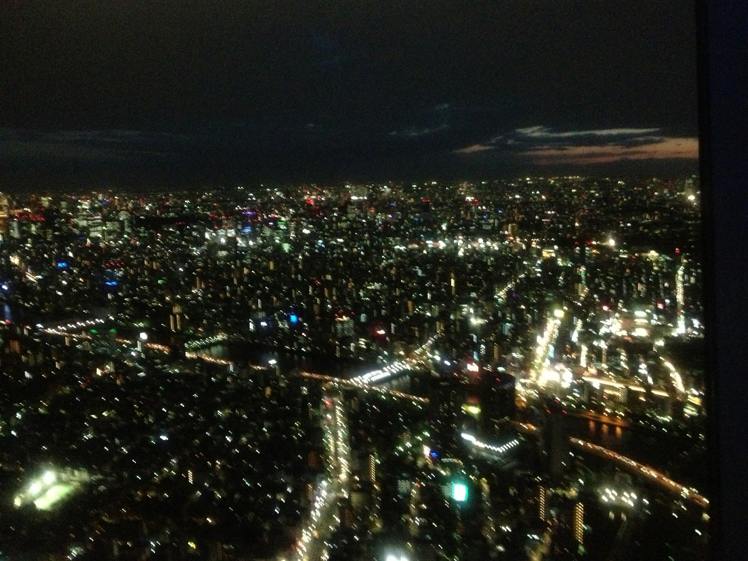 Tokyo cityscape at night with sparkling lights from skyscrapers