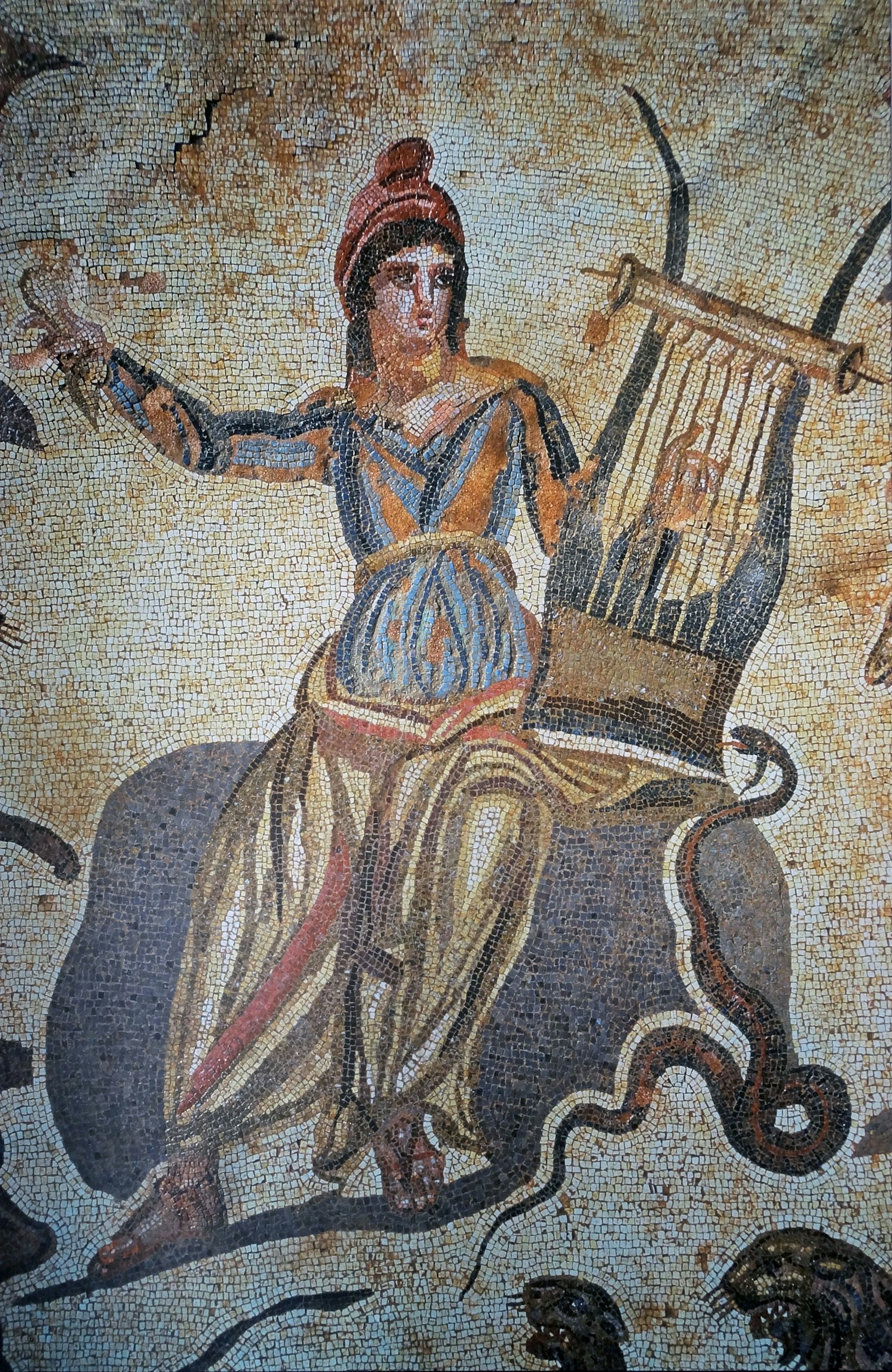 Ancient woman seated with a lyre in a mural