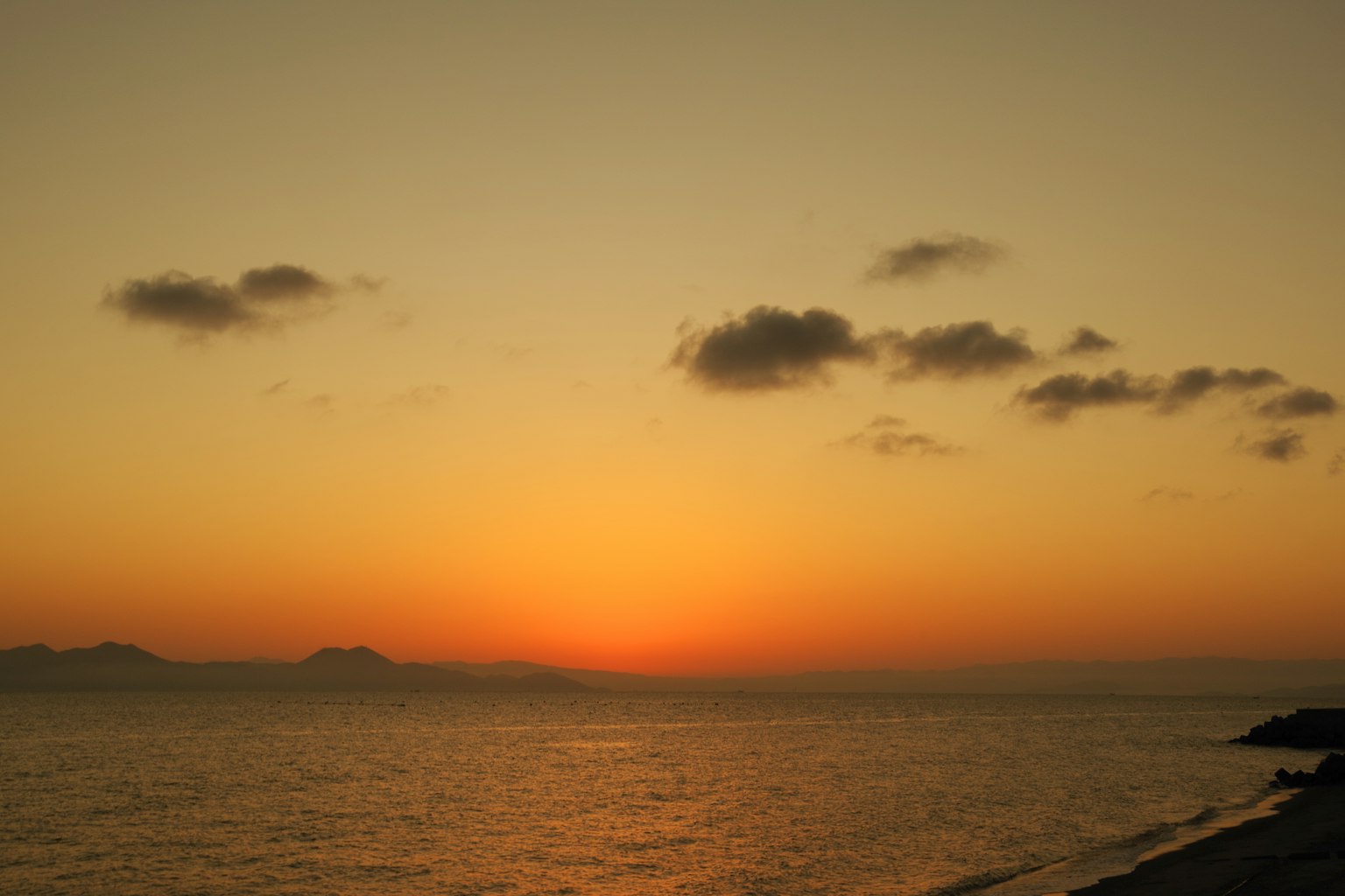 Stunning sunset over the ocean with silhouettes of distant islands