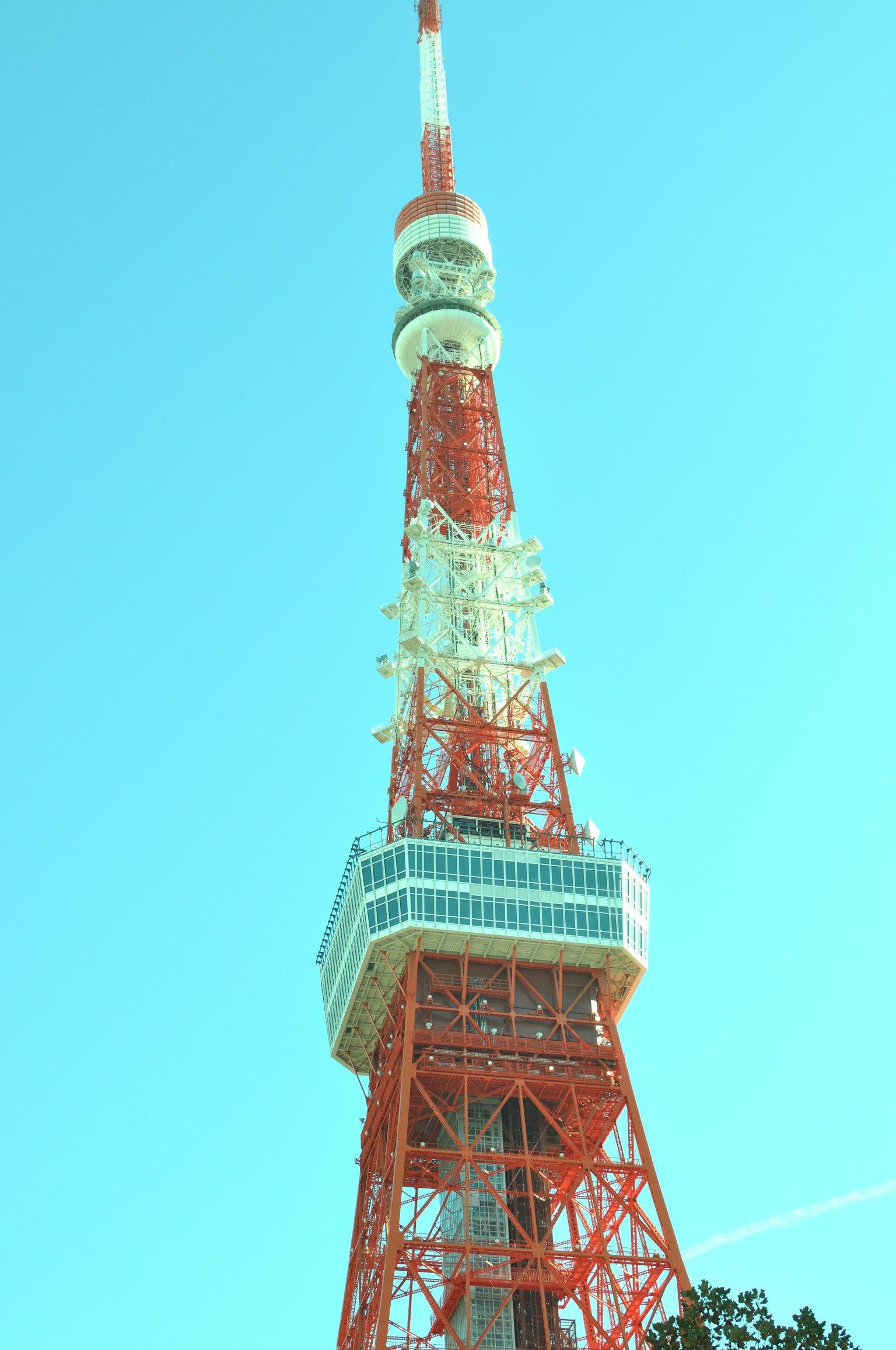 Tokyo Tower in red and white structure against blue sky